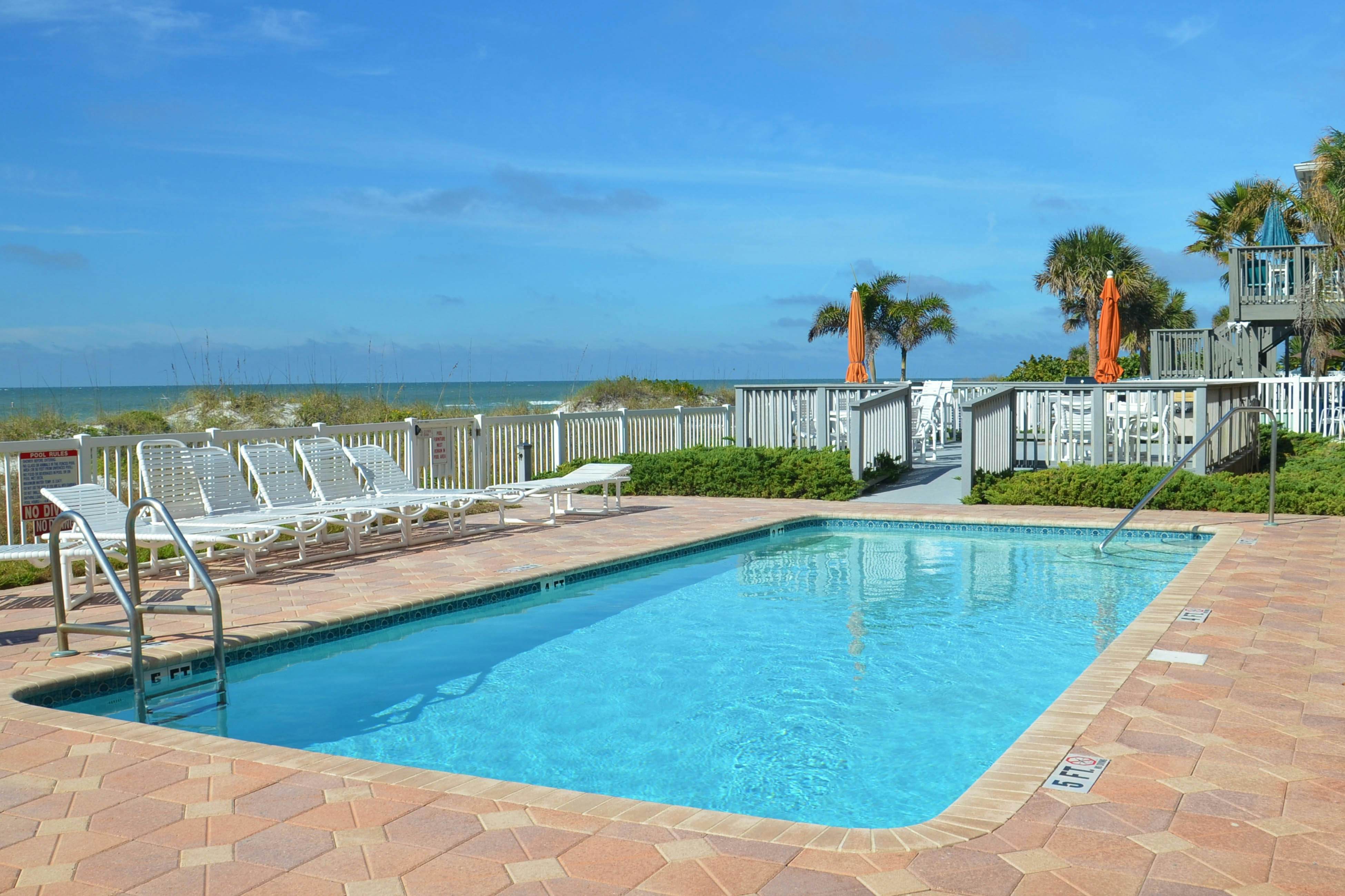 Beautiful oceanfront condo on the beach with pool & WiFi, walk to restaurants