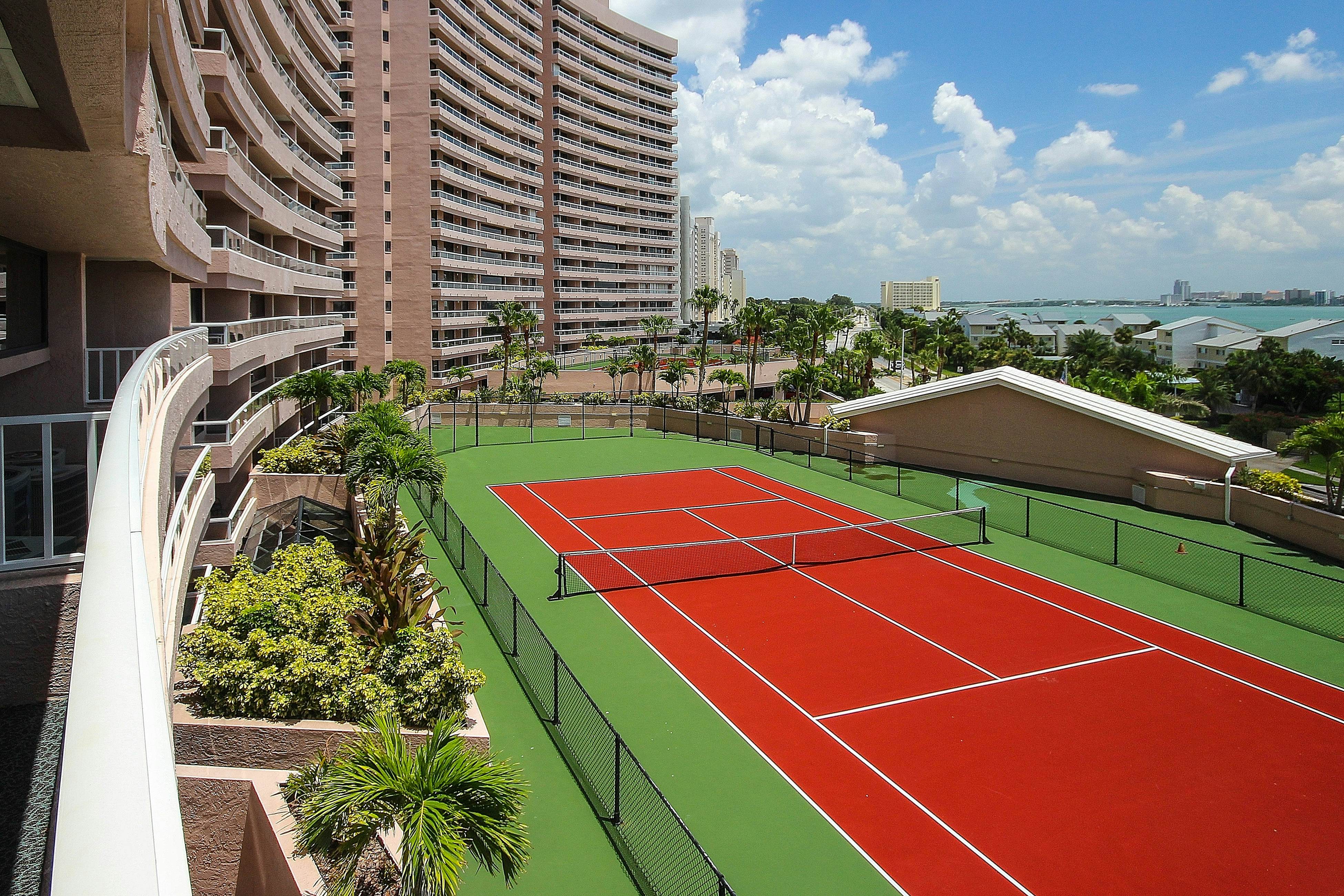 Vibrant, ocean-view condo with hot tub, tennis court, pool, W/D, balcony & grill