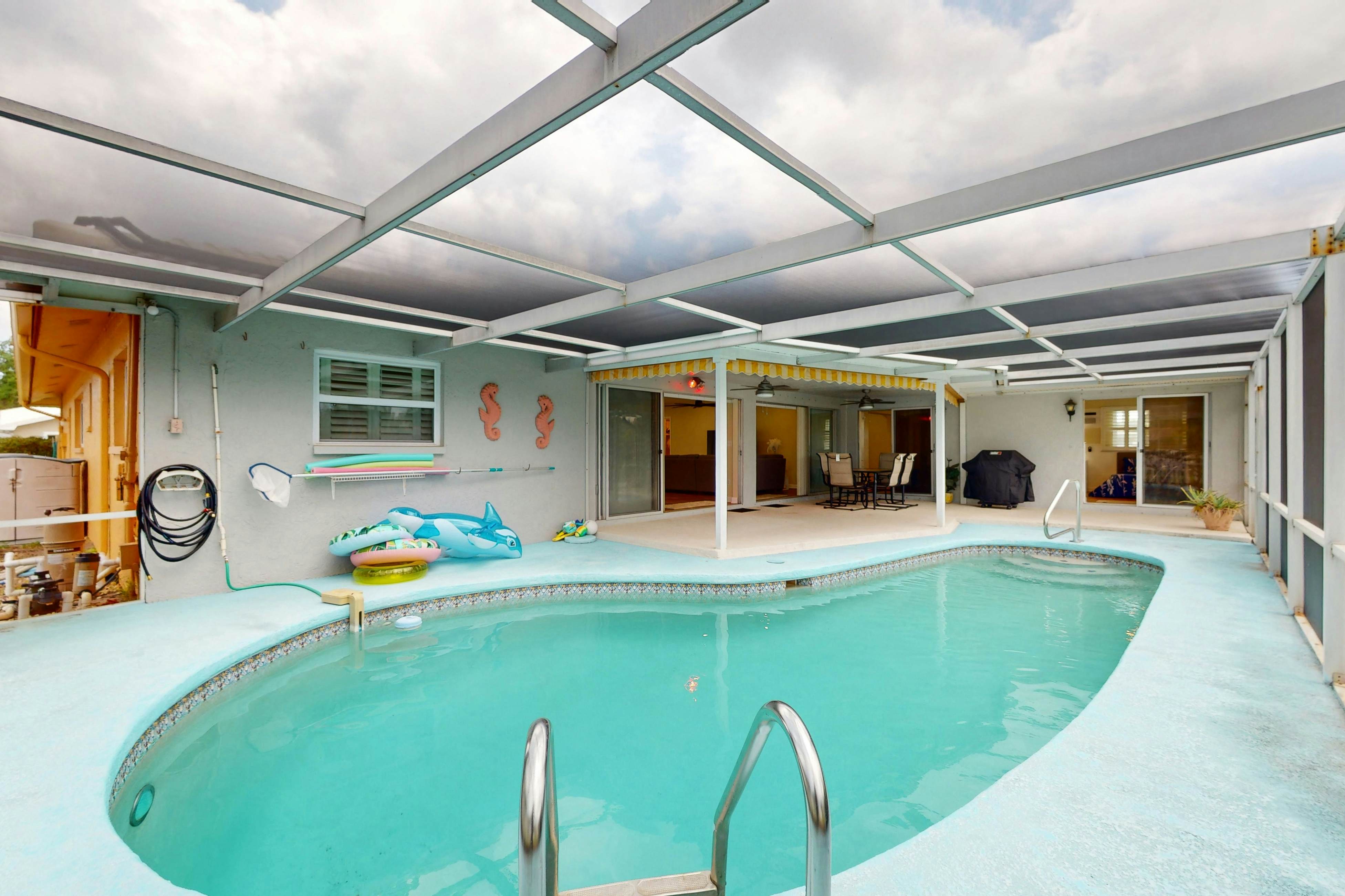 Canal-front home with private pool, dock, grill, canal views, & W/D