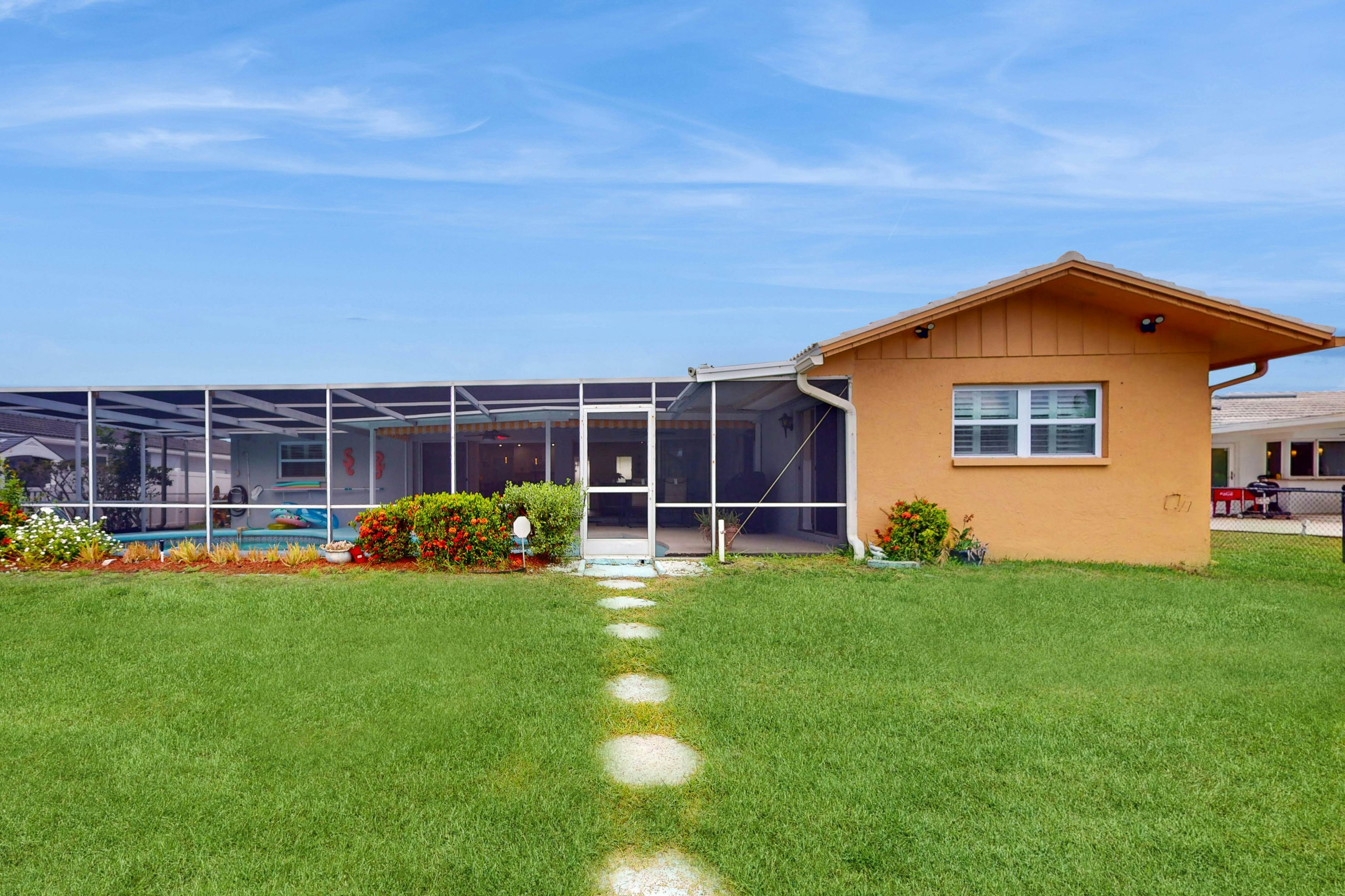 Canal-front home with private pool, dock, grill, canal views, & W/D