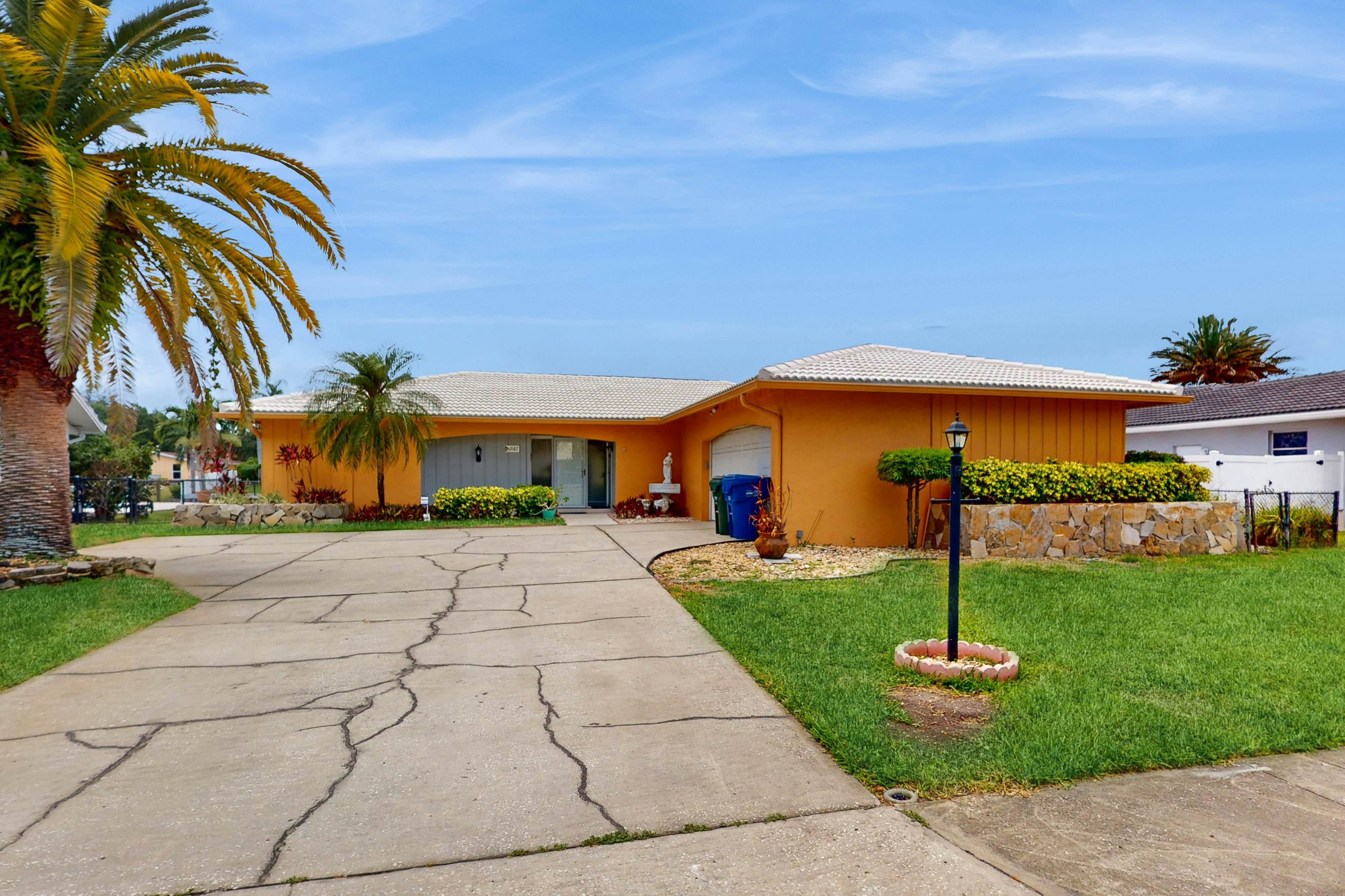 Canal-front home with private pool, dock, grill, canal views, & W/D