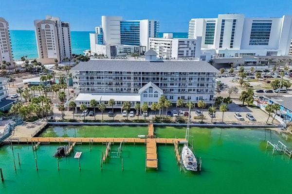 Steps to Gulf beaches family friendly condo with water views shared pool AC