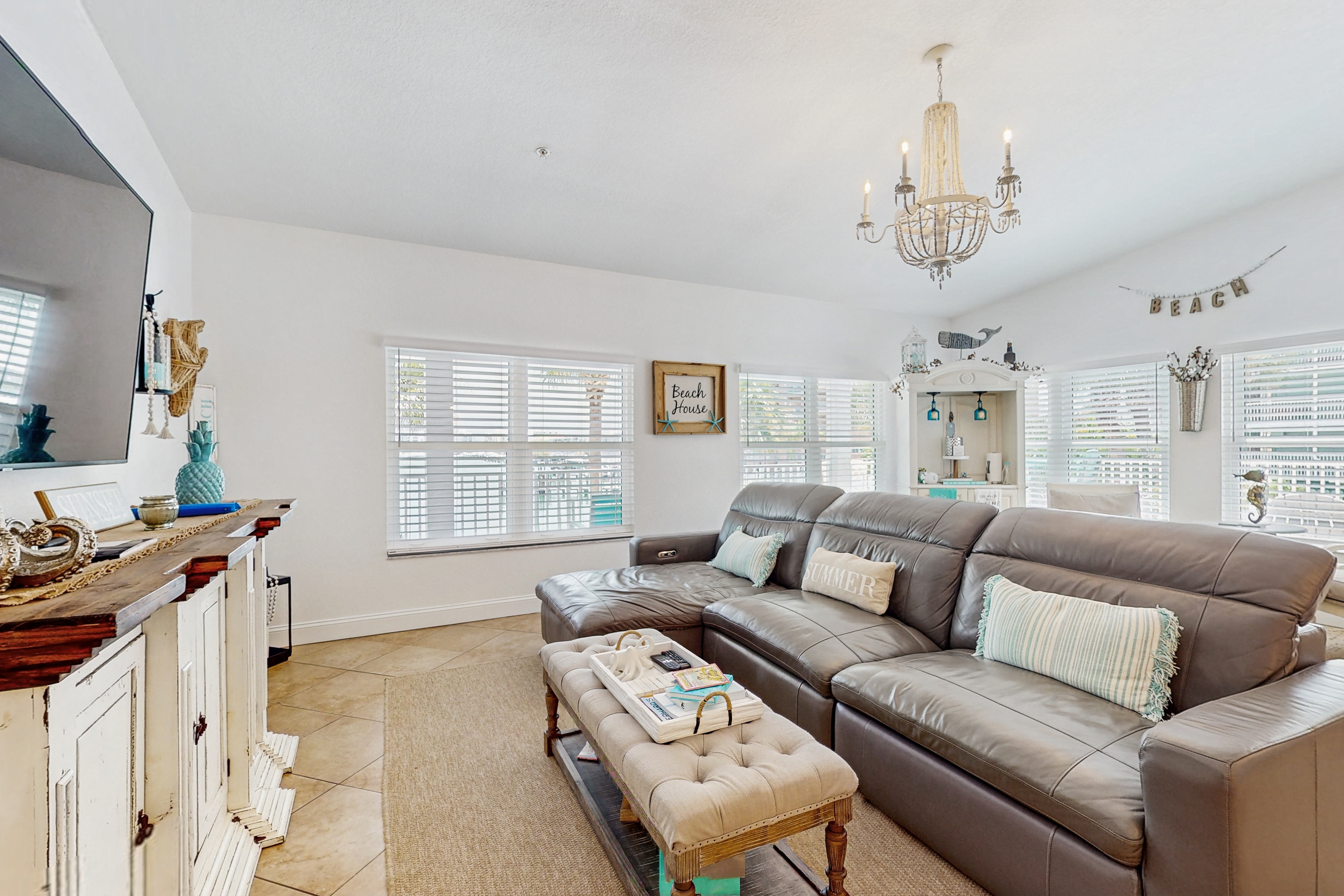 Steps to Gulf beaches family friendly condo with water views shared pool AC