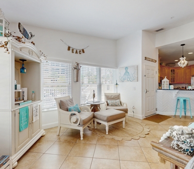 Steps to Gulf beaches family friendly condo with water views shared pool AC