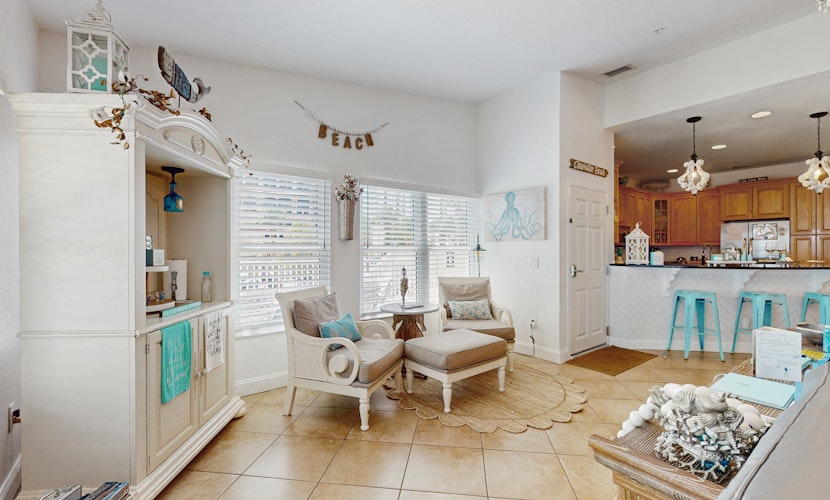 Steps to Gulf beaches family friendly condo with water views shared pool AC