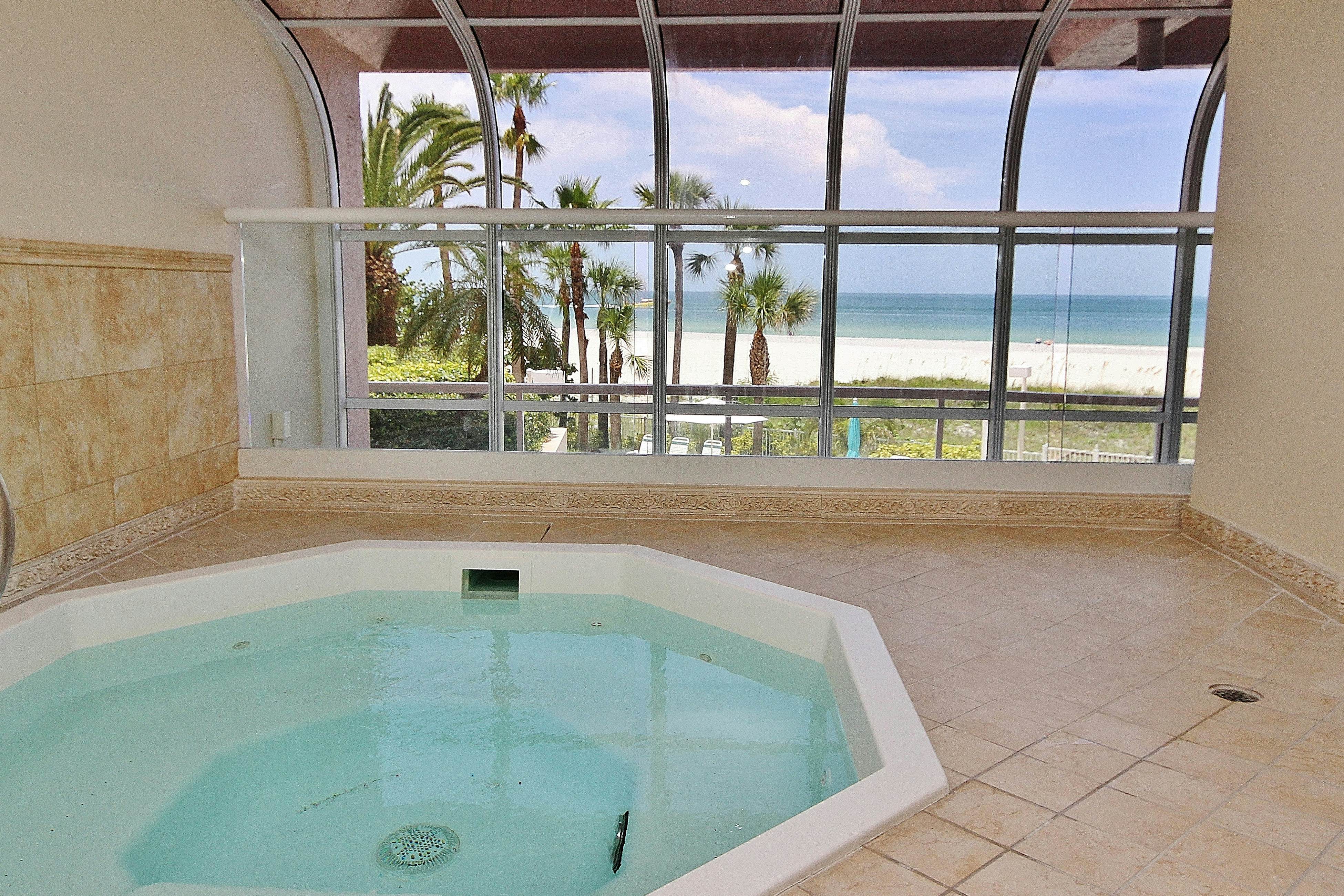 Beachfront condo with great views, balcony, heated pool, sauna & hot tub