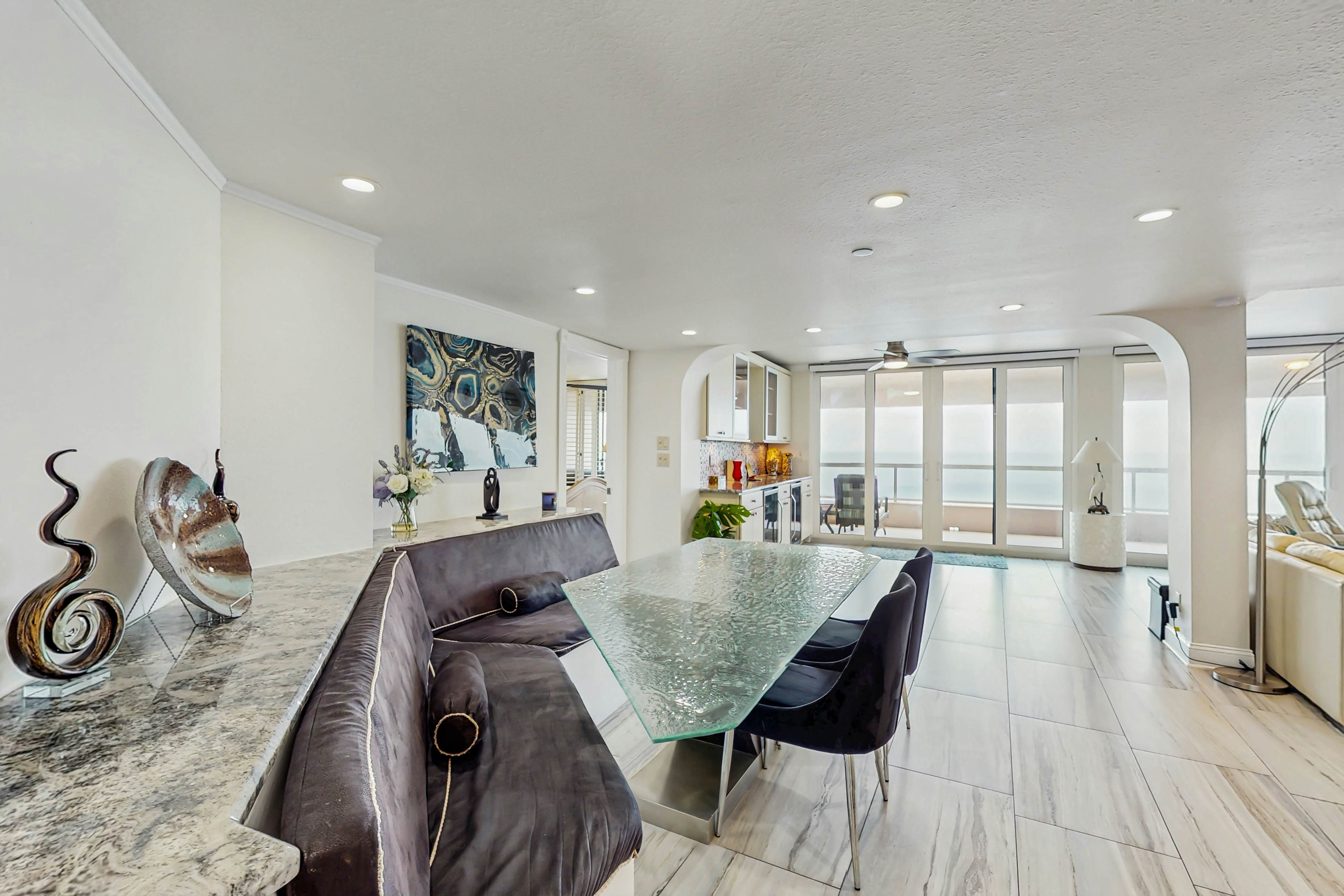 Luxe penthouse with balcony, sweeping views, heated pool, spa, hot tub & gym