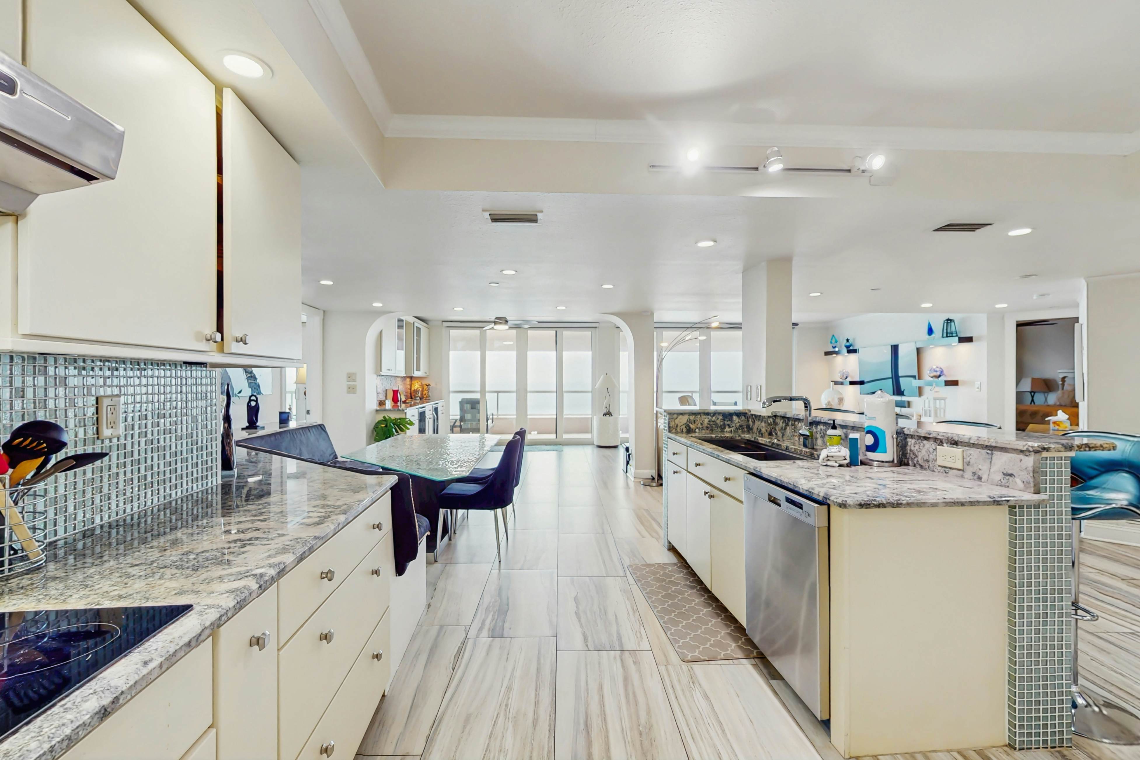 Luxe penthouse with balcony, sweeping views, heated pool, spa, hot tub & gym