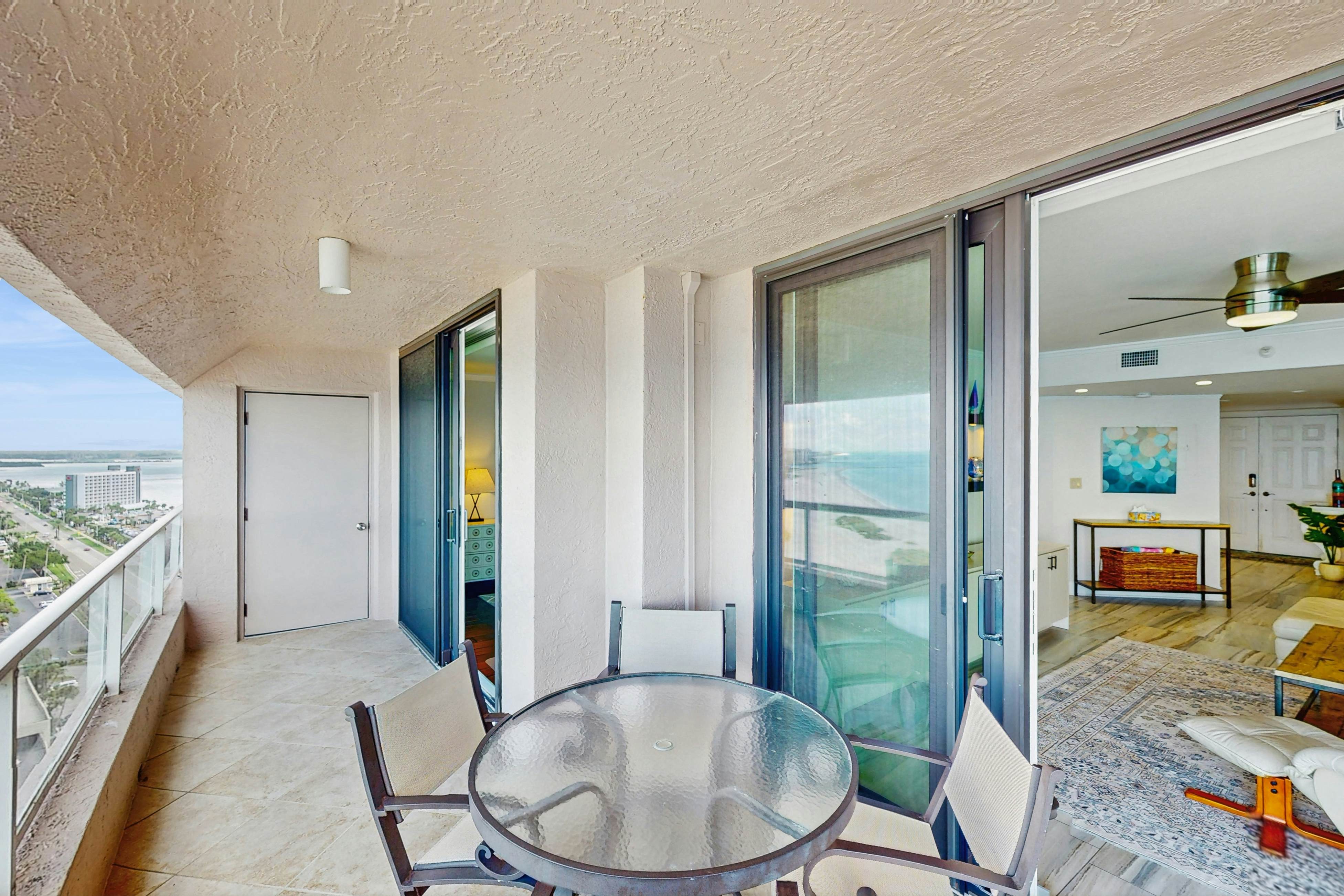 Luxe penthouse with balcony, sweeping views, heated pool, spa, hot tub & gym