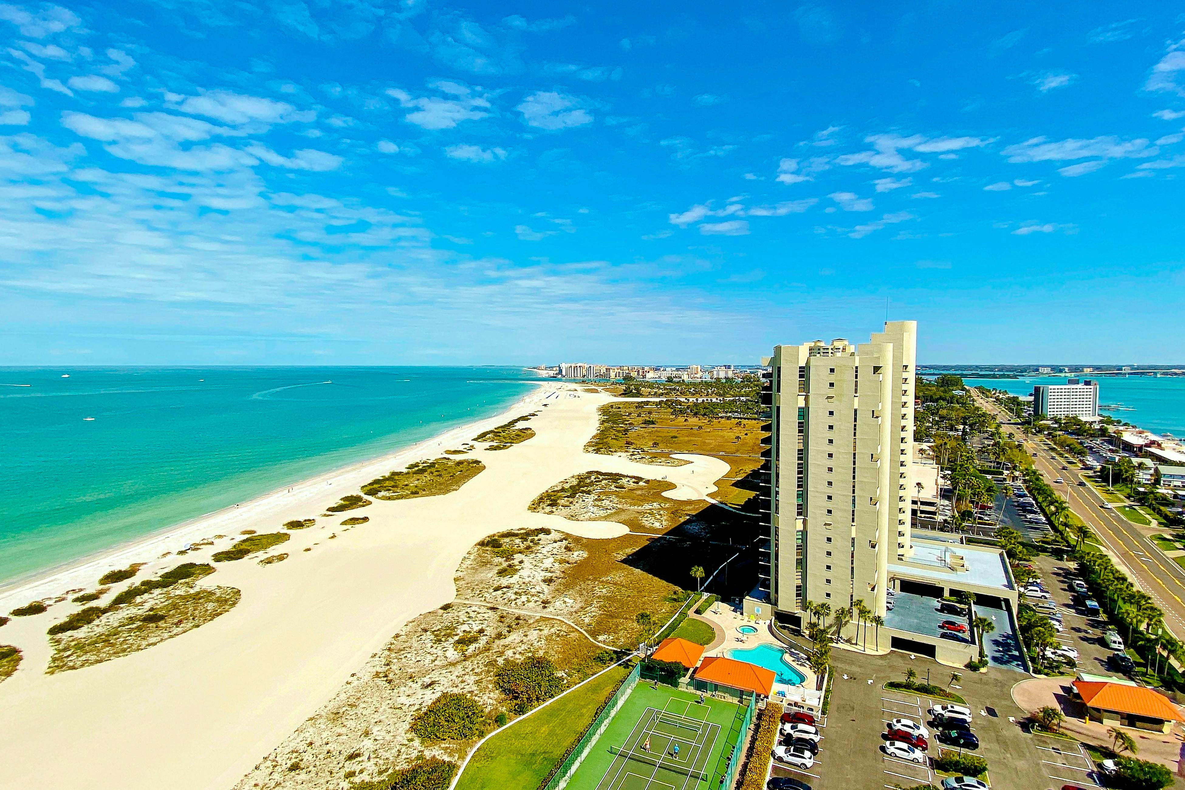 Luxe penthouse with balcony, sweeping views, heated pool, spa, hot tub & gym