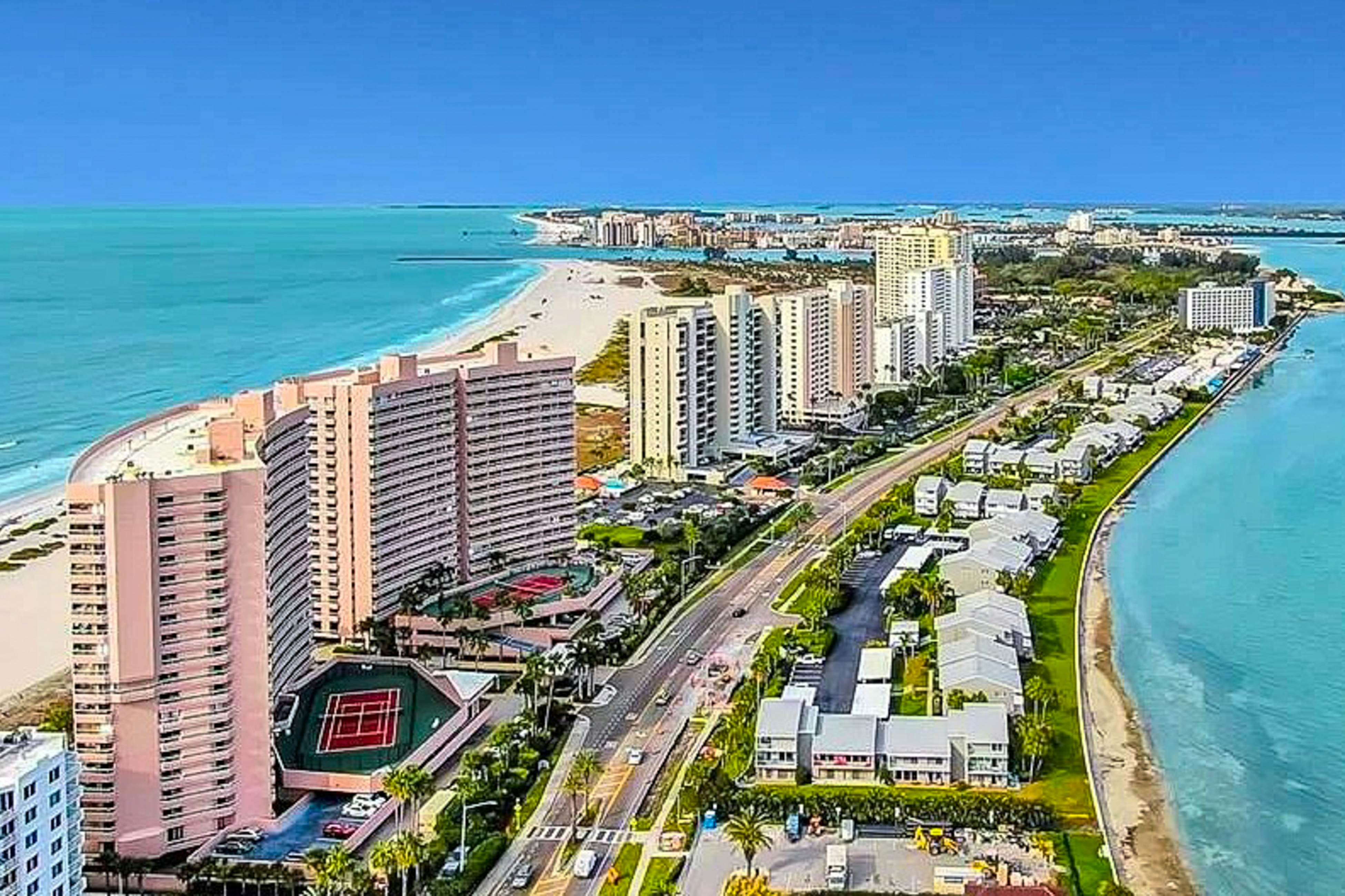 Luxe penthouse with balcony, sweeping views, heated pool, spa, hot tub & gym