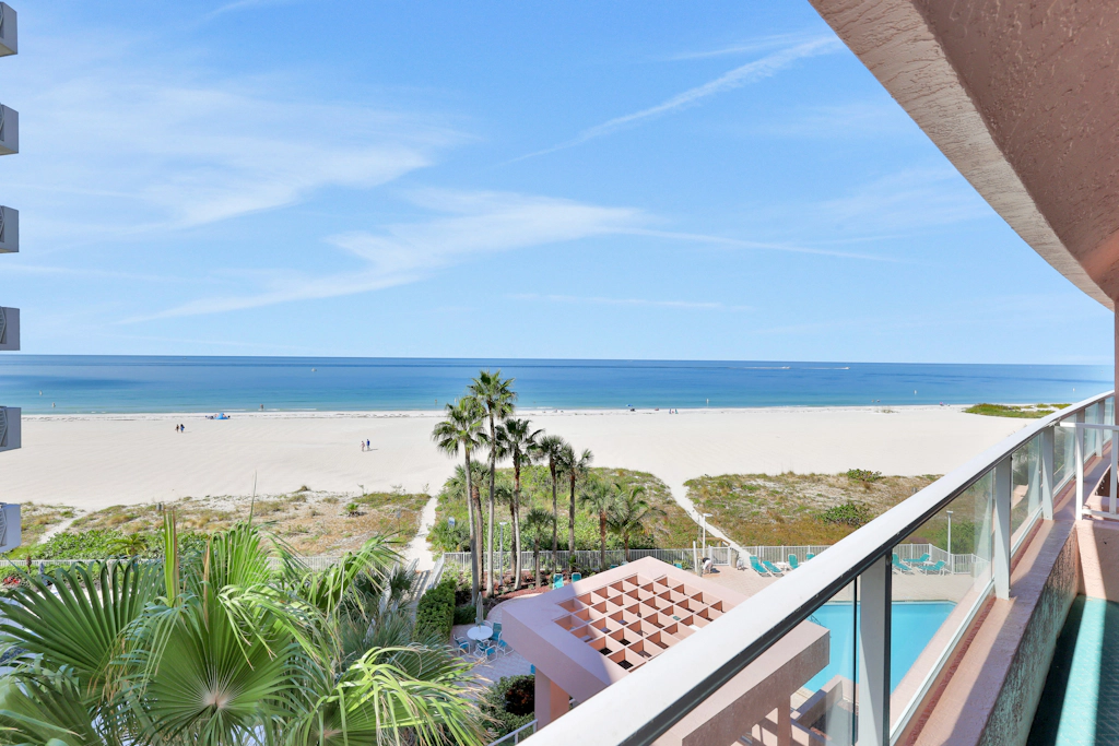 Beachfront condo with multiple balconies heated pool gym hot tub and AC