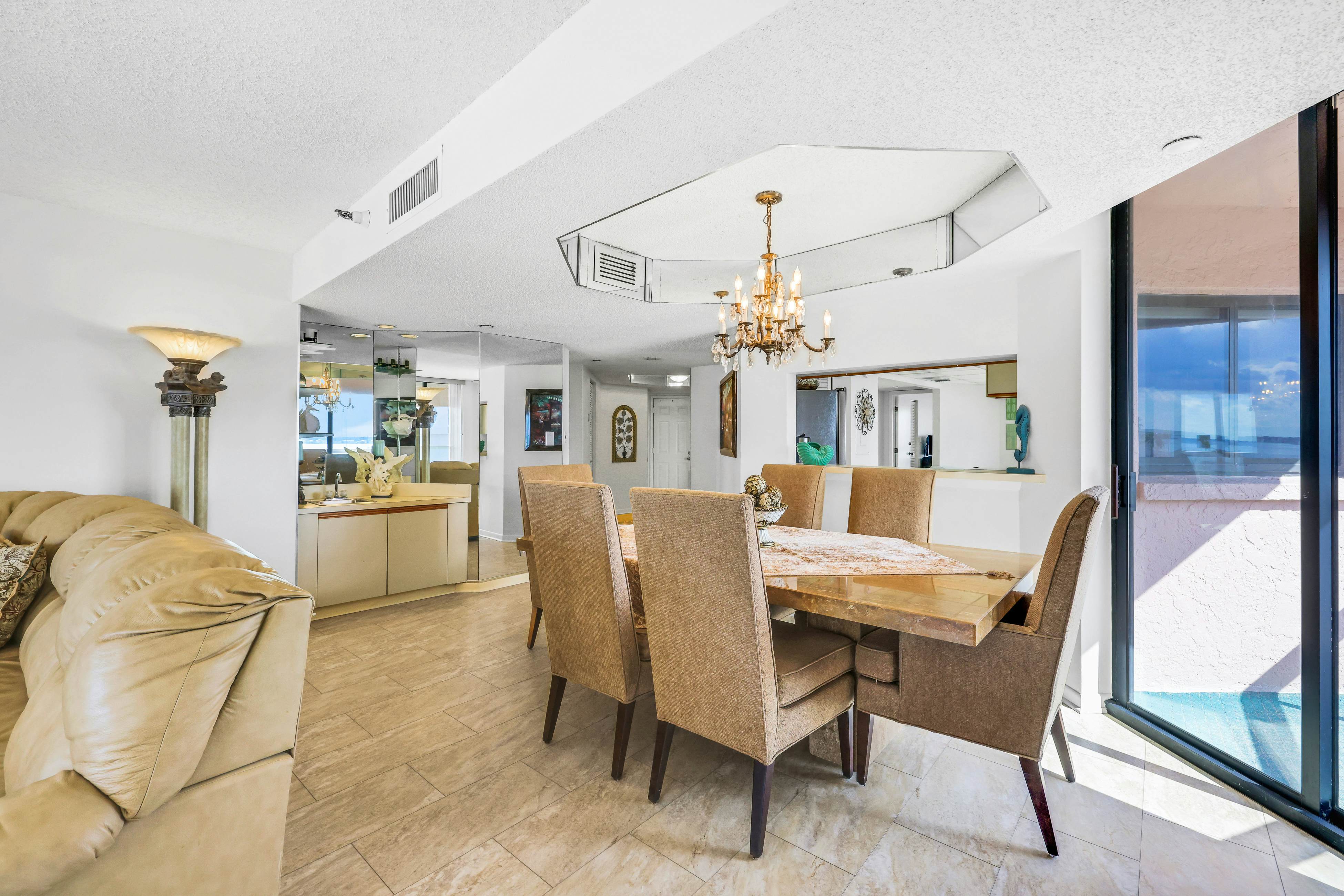 Beachfront condo with multiple balconies, heated pool, gym, hot tub & AC