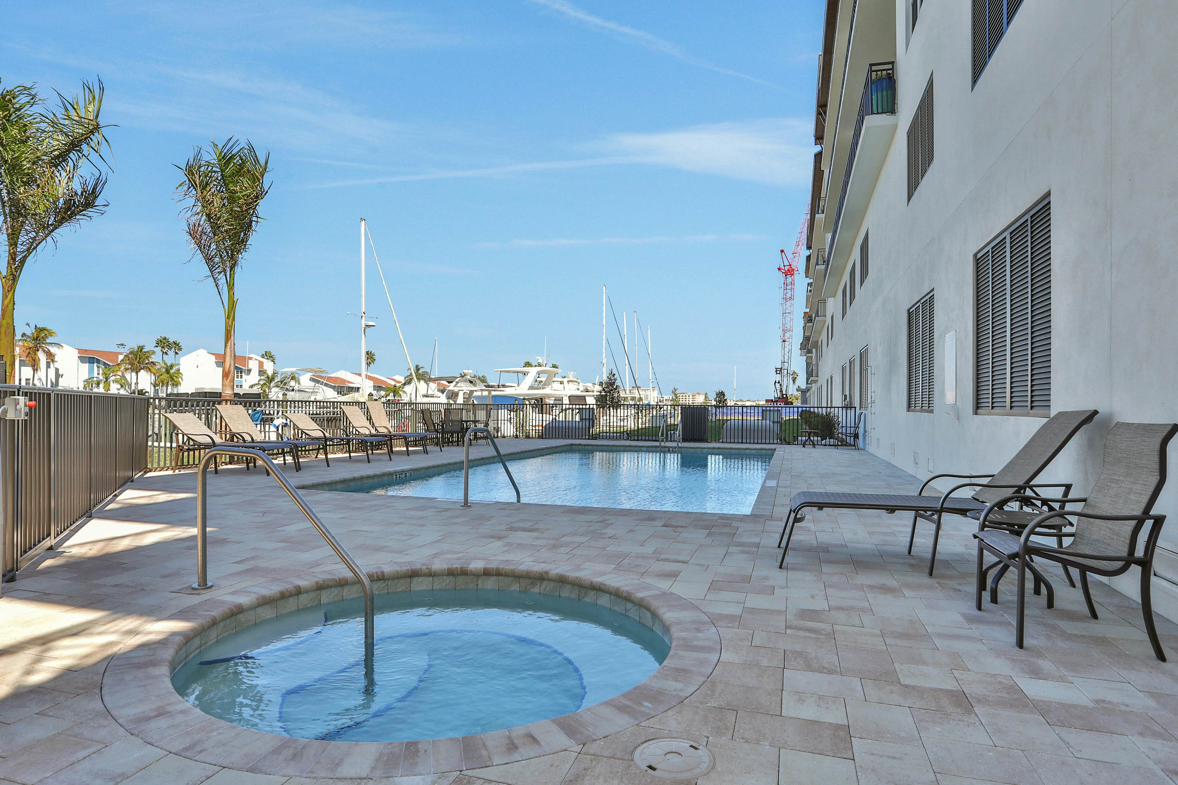 Brand-new condo steps to beach with balcony, pool, & hot tub - dog-friendly