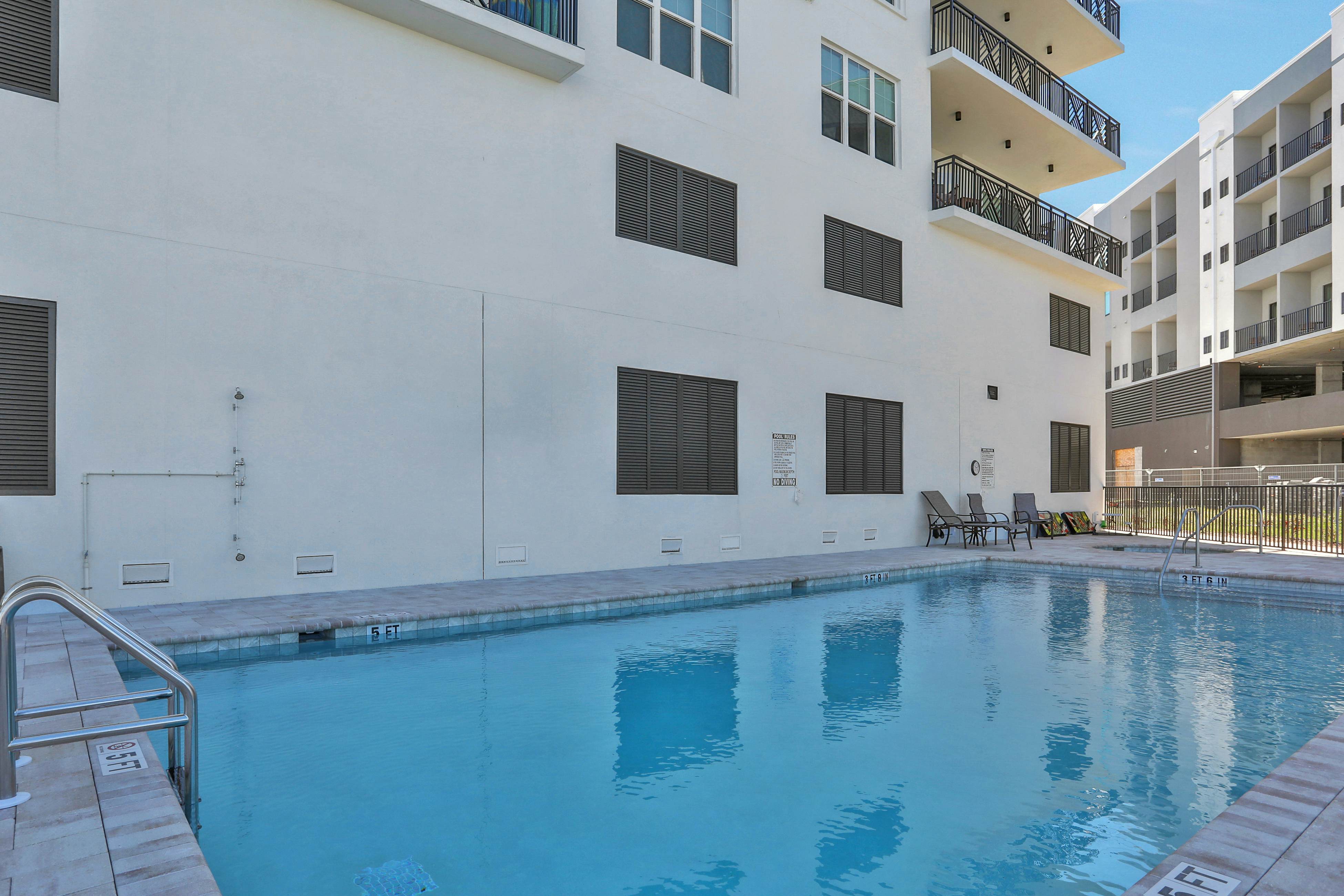 Brand-new condo steps to beach with balcony, pool, & hot tub - dog-friendly