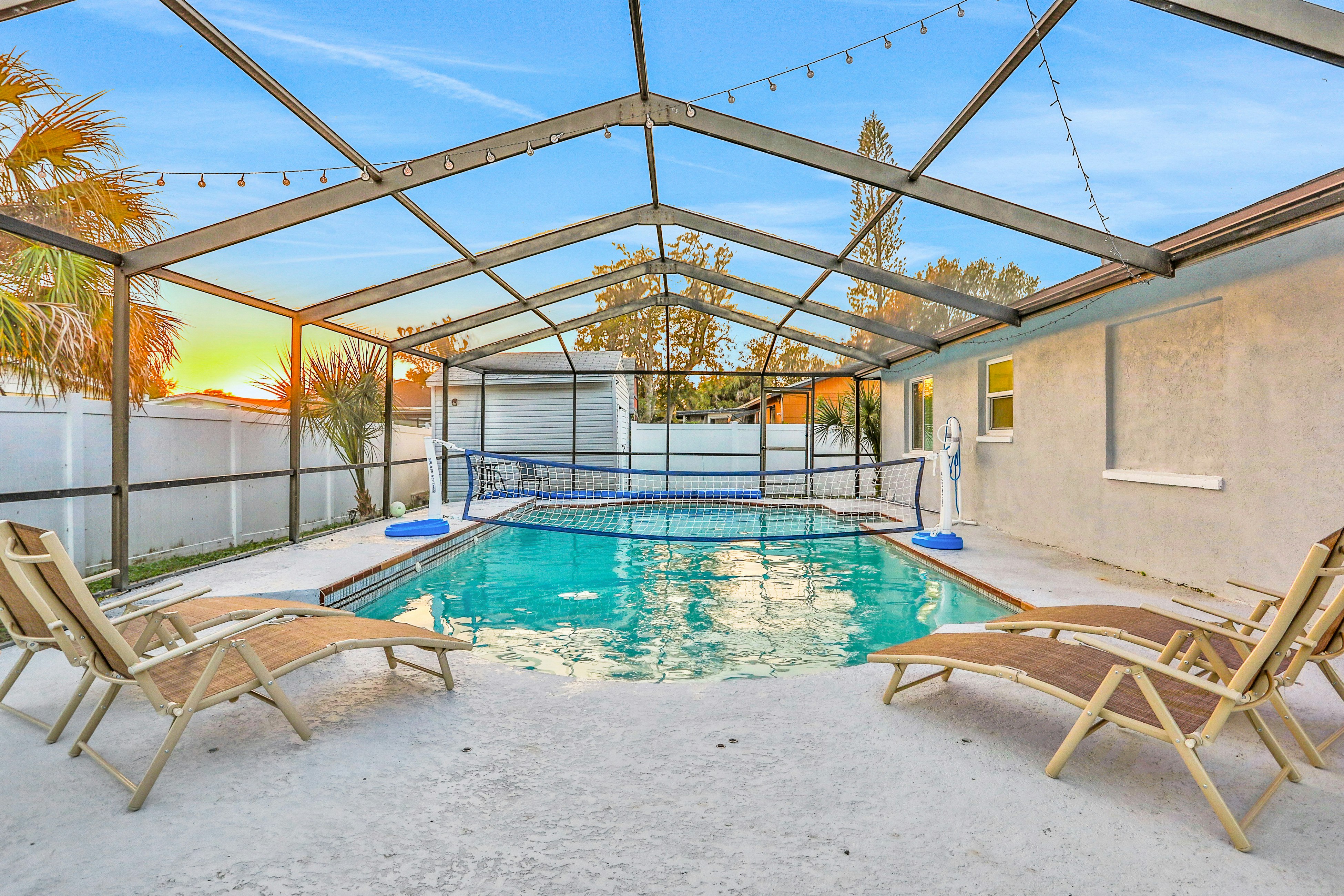 Dog-friendly tropical stay with a private pool, grill, game tables, & central AC