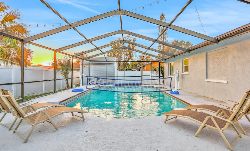 Dog friendly tropical stay with a private pool grill game tables and central AC