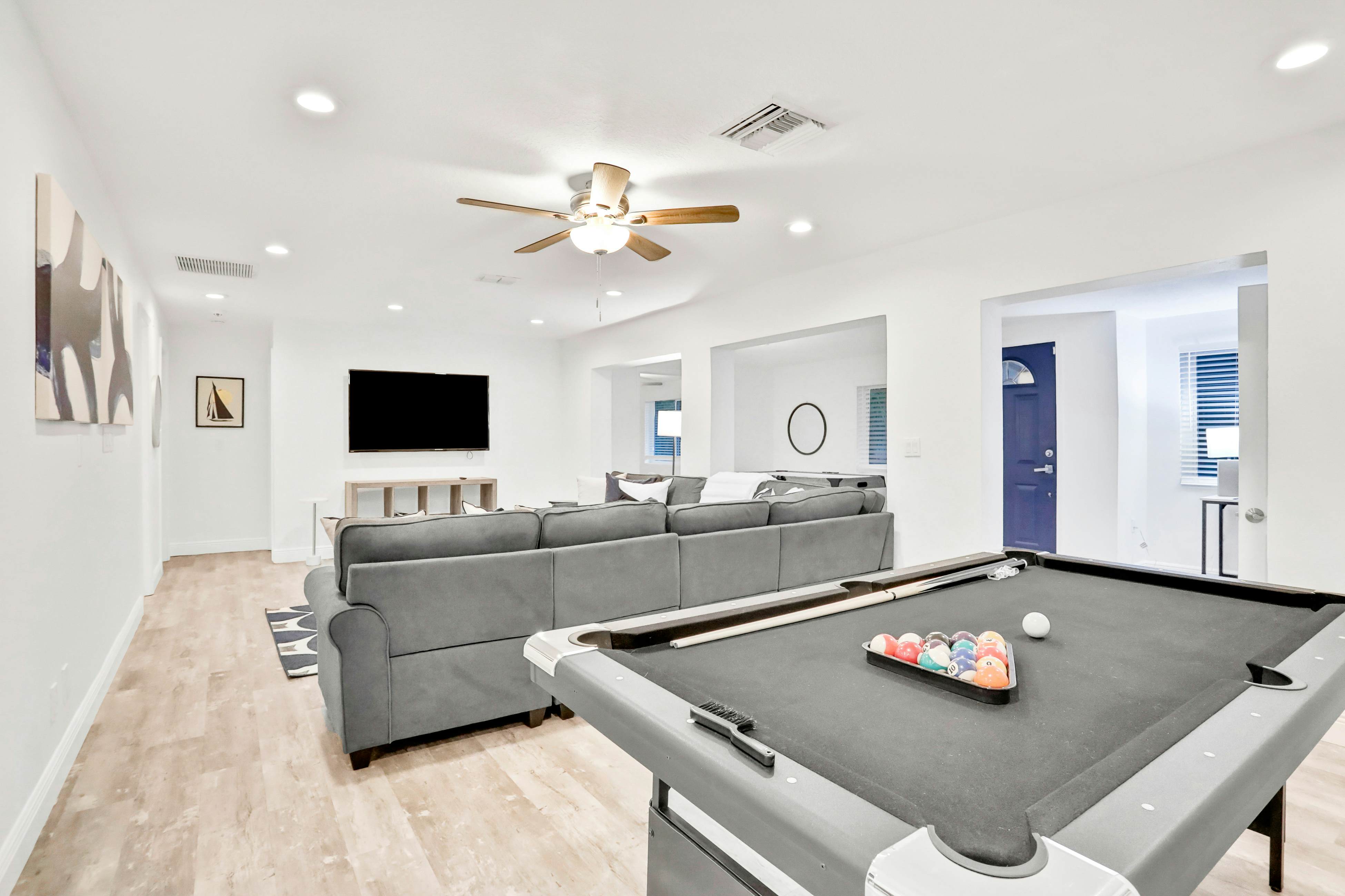 Dog-friendly tropical stay with a private pool, grill, game tables, & central AC