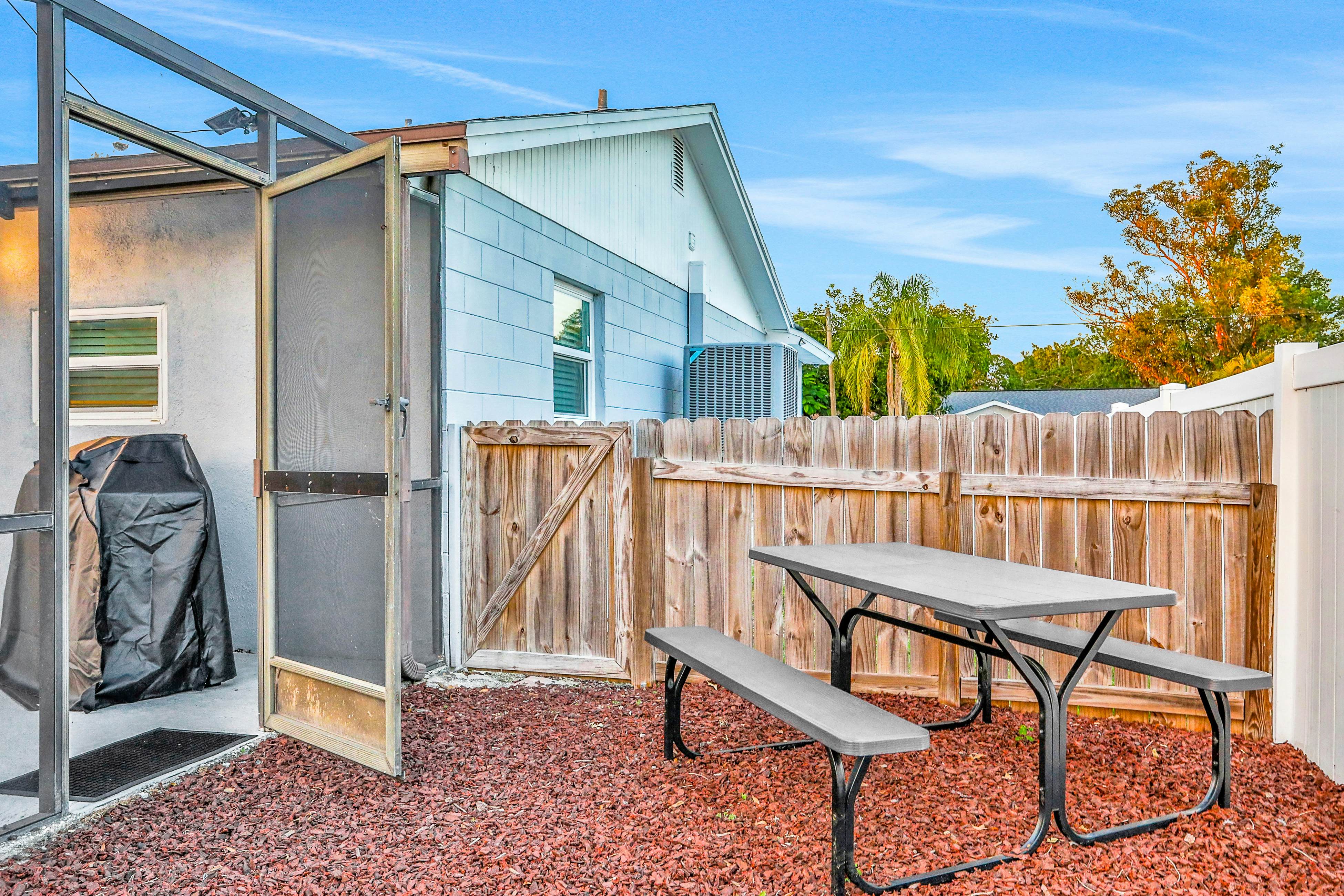 Dog-friendly tropical stay with a private pool, grill, game tables, & central AC