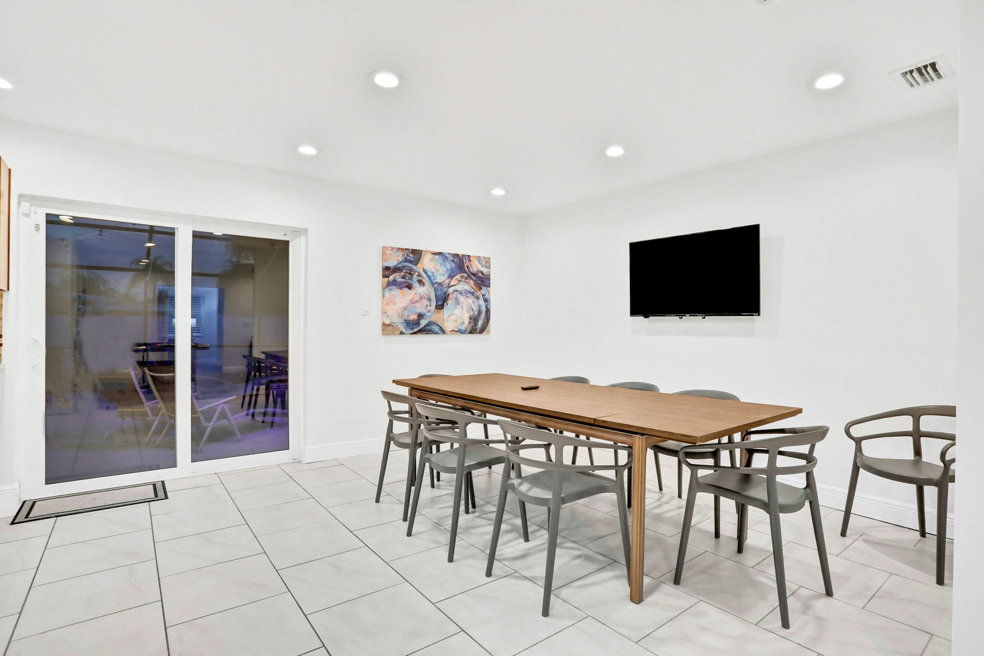 Dog-friendly tropical stay with a private pool, grill, game tables, & central AC