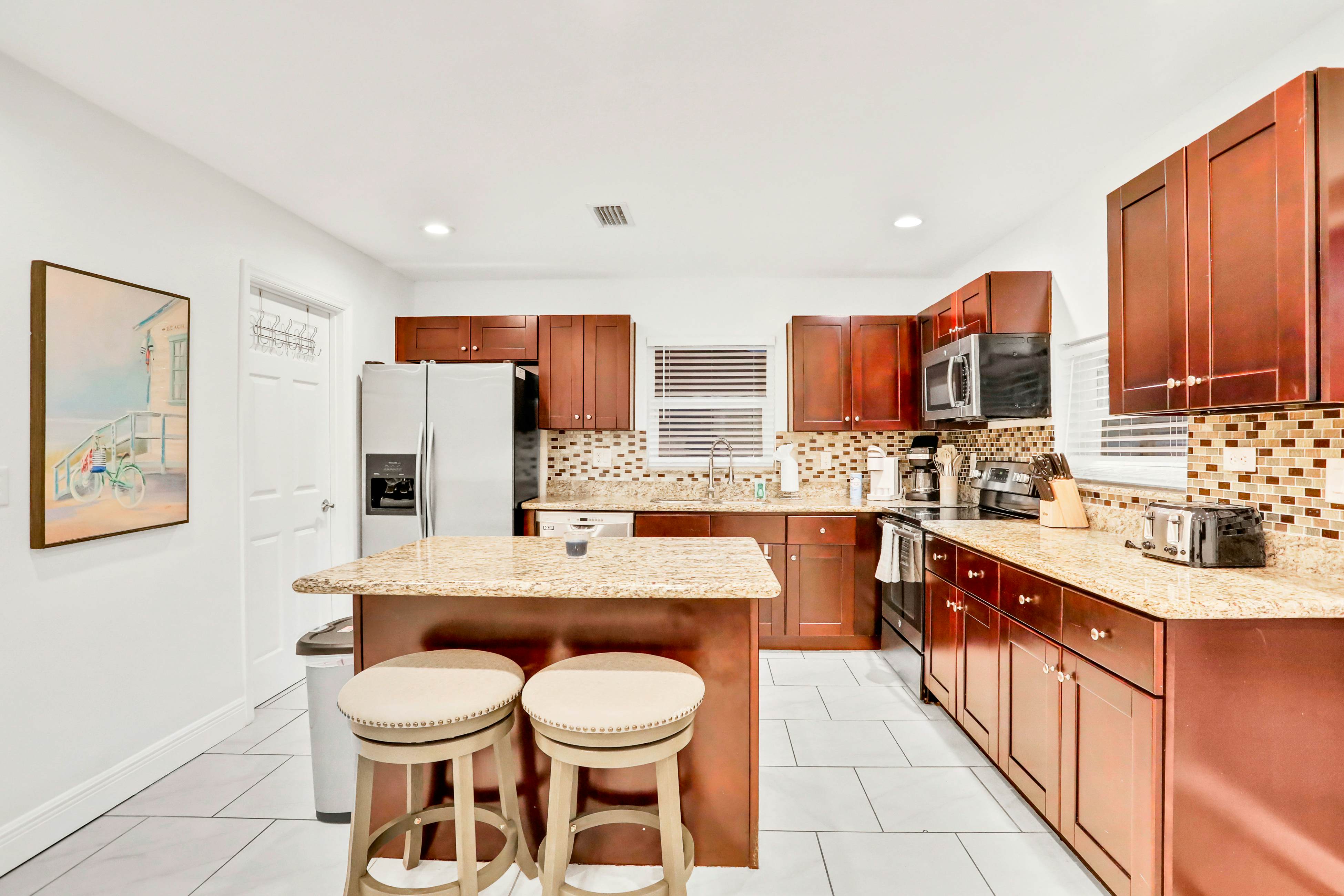 Dog-friendly tropical stay with a private pool, grill, game tables, & central AC