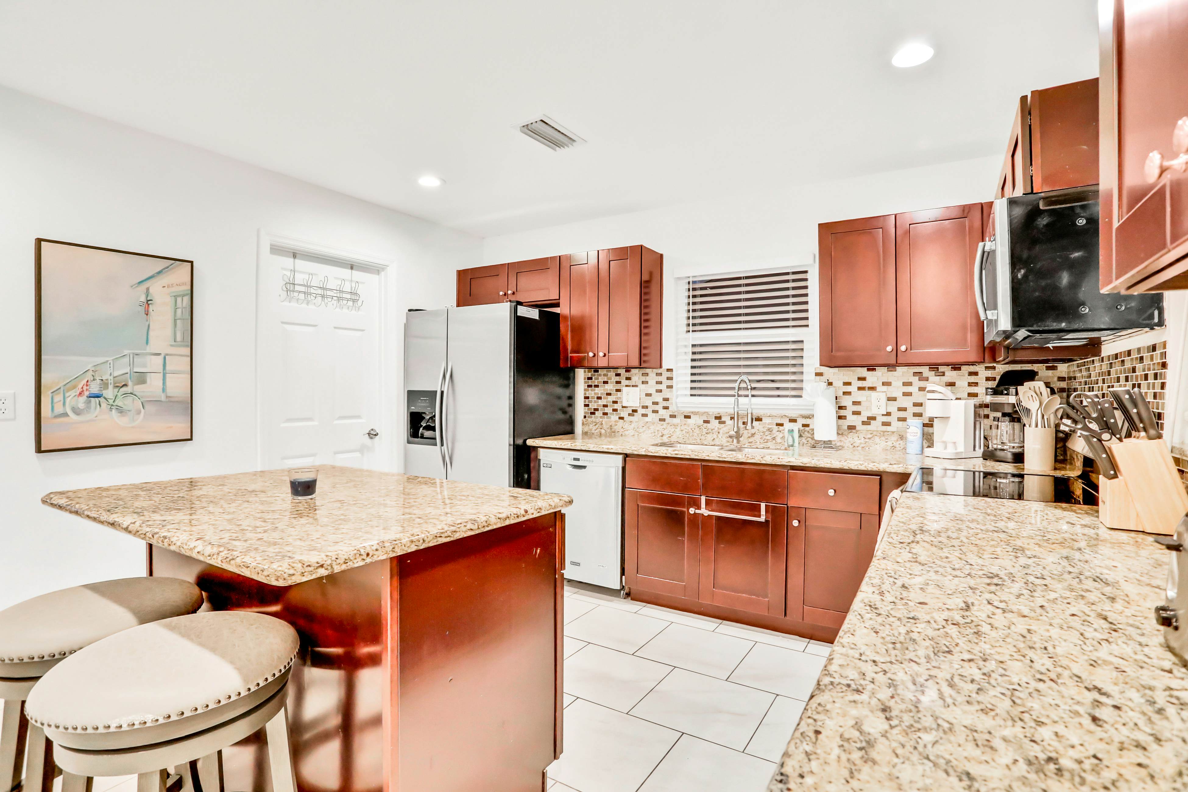 Dog-friendly tropical stay with a private pool, grill, game tables, & central AC