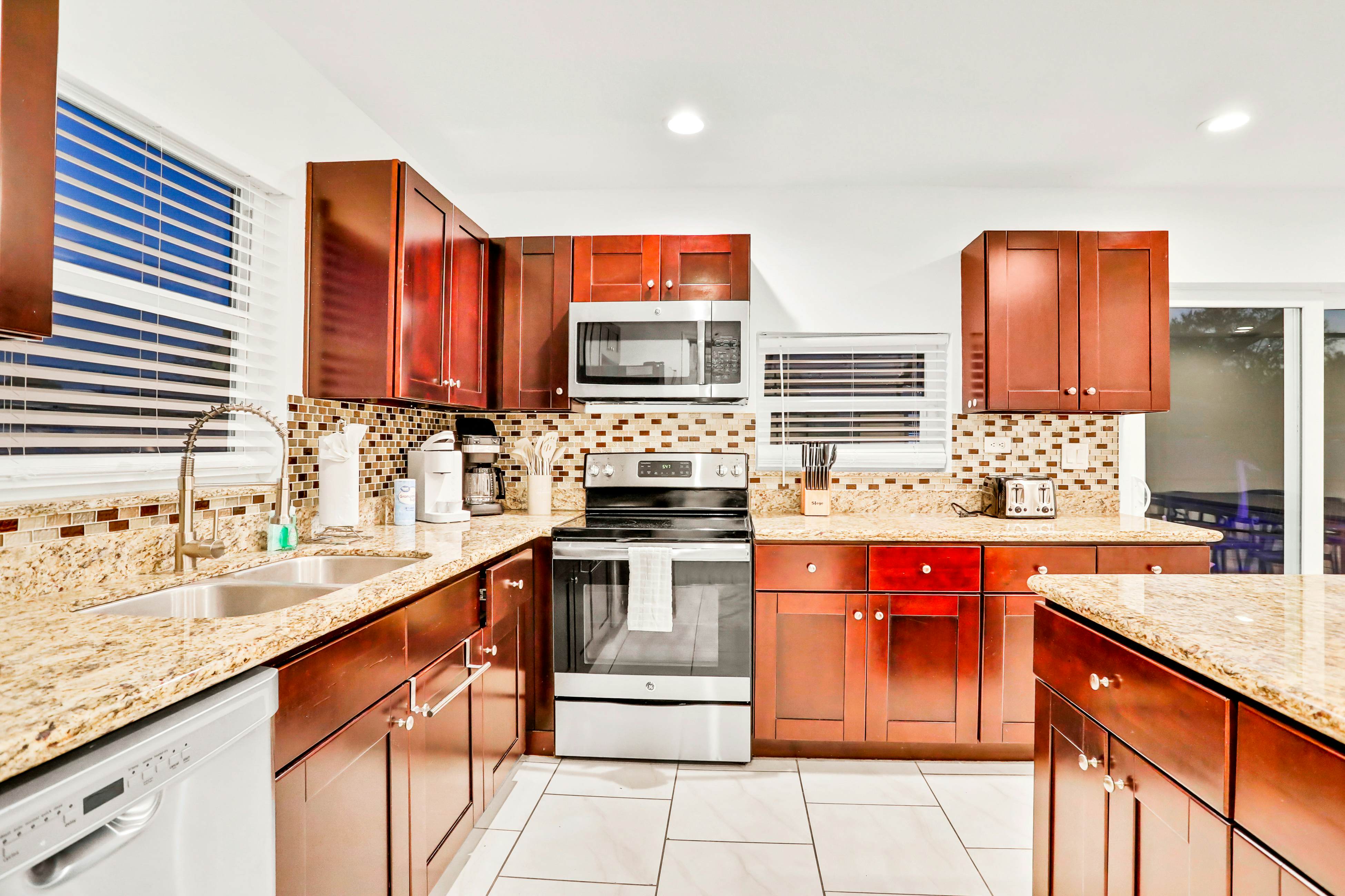 Dog-friendly tropical stay with a private pool, grill, game tables, & central AC