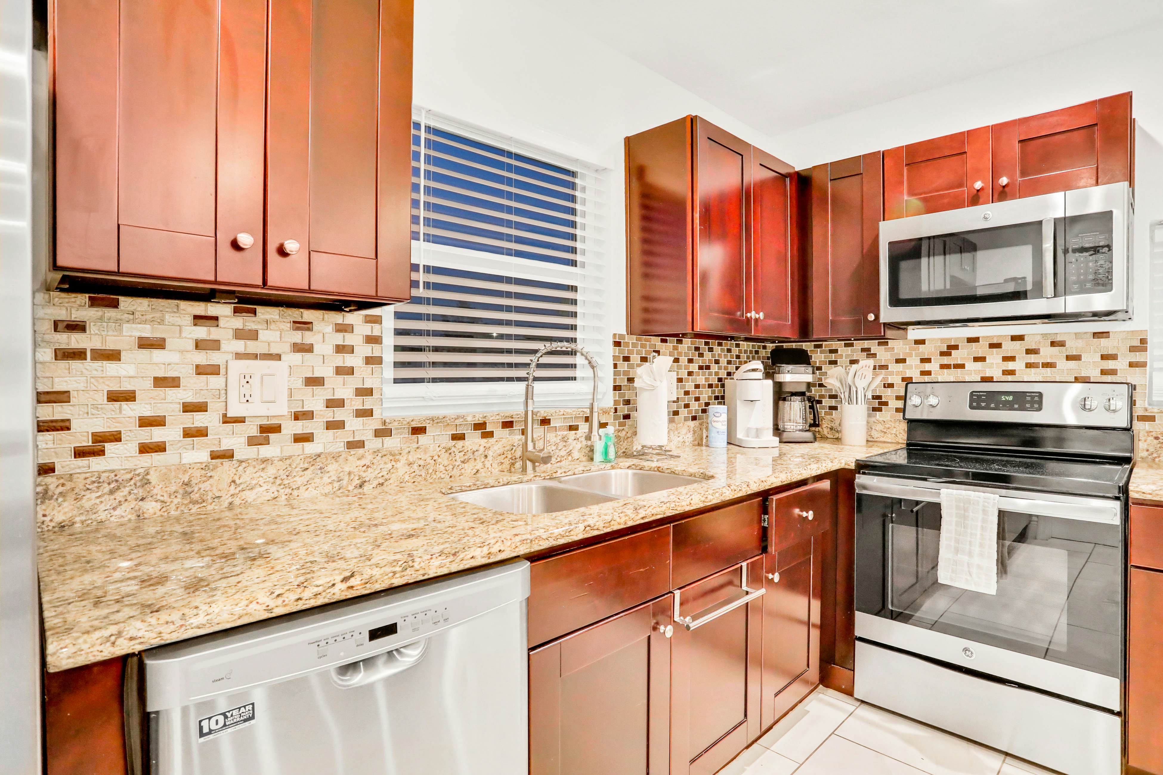 Dog-friendly tropical stay with a private pool, grill, game tables, & central AC