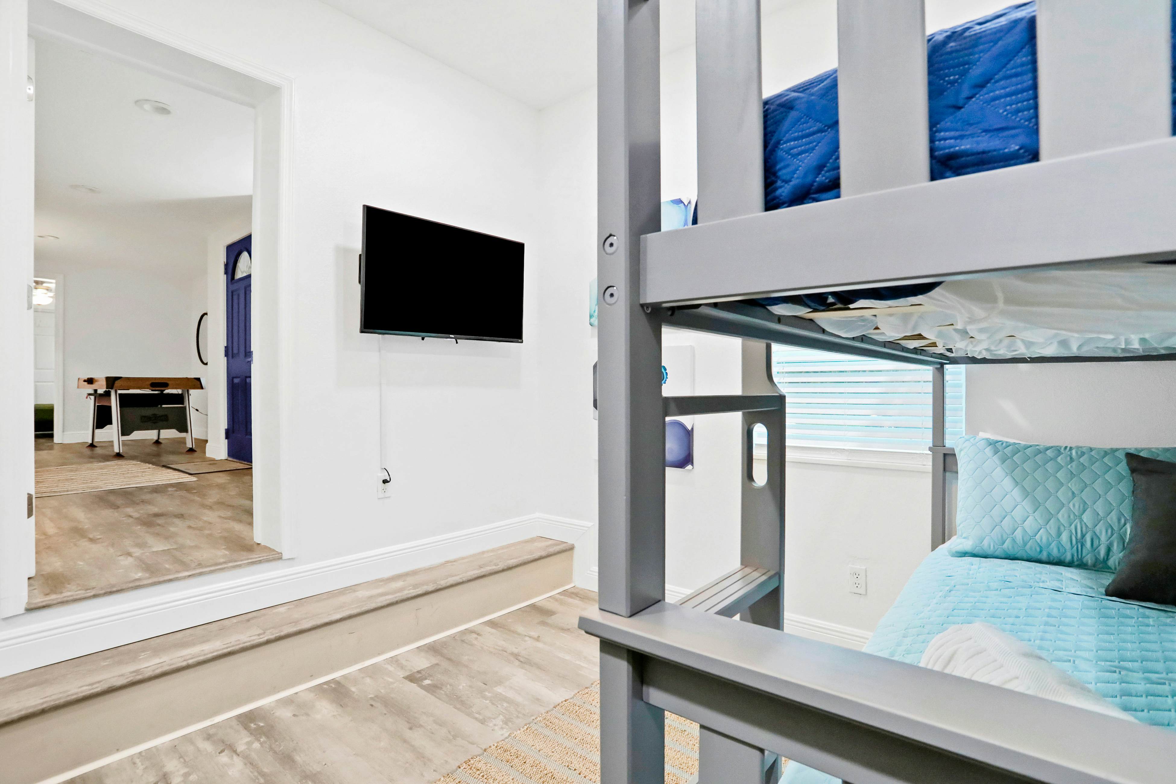 Dog-friendly tropical stay with a private pool, grill, game tables, & central AC