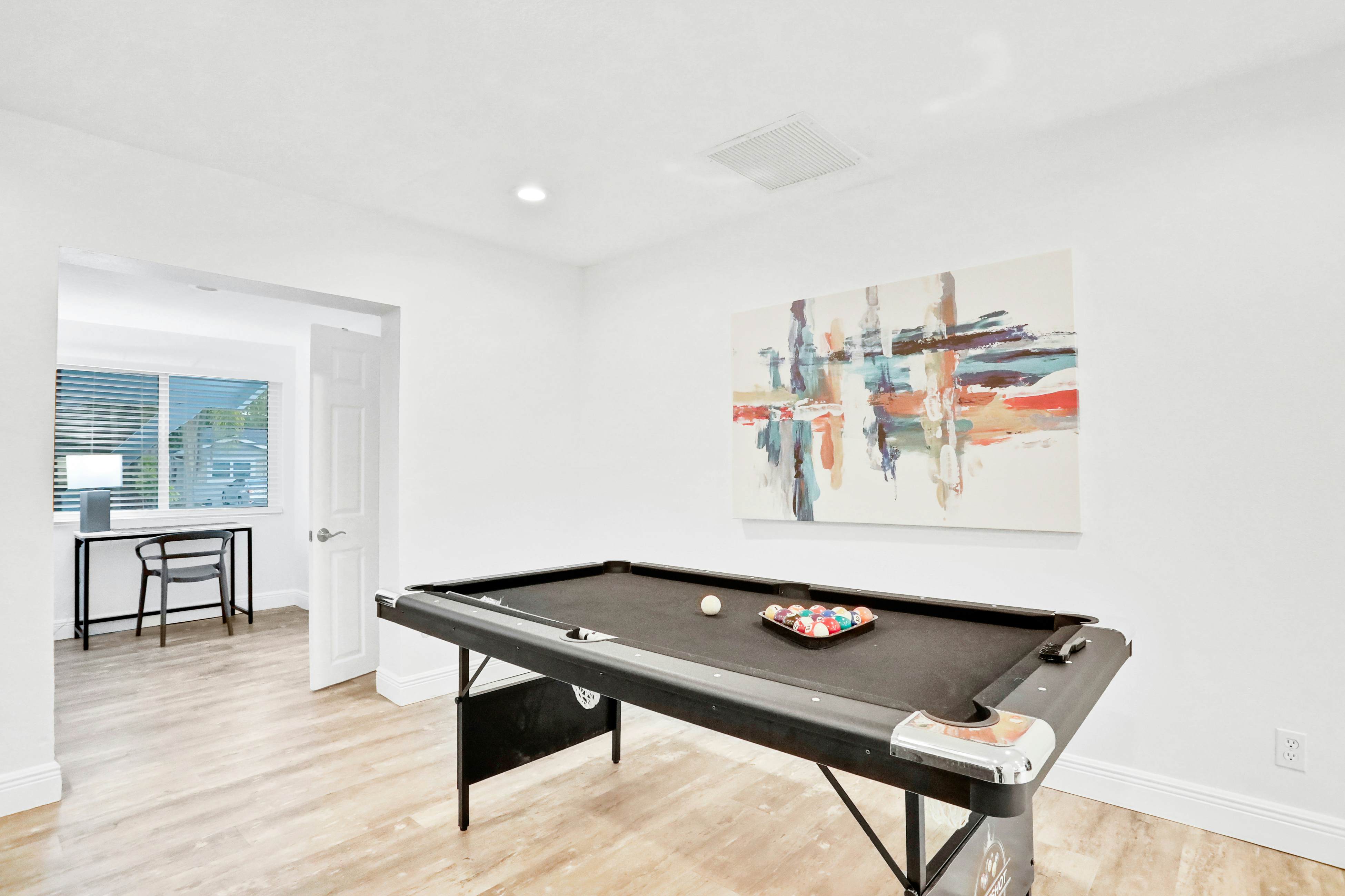 Dog-friendly tropical stay with a private pool, grill, game tables, & central AC