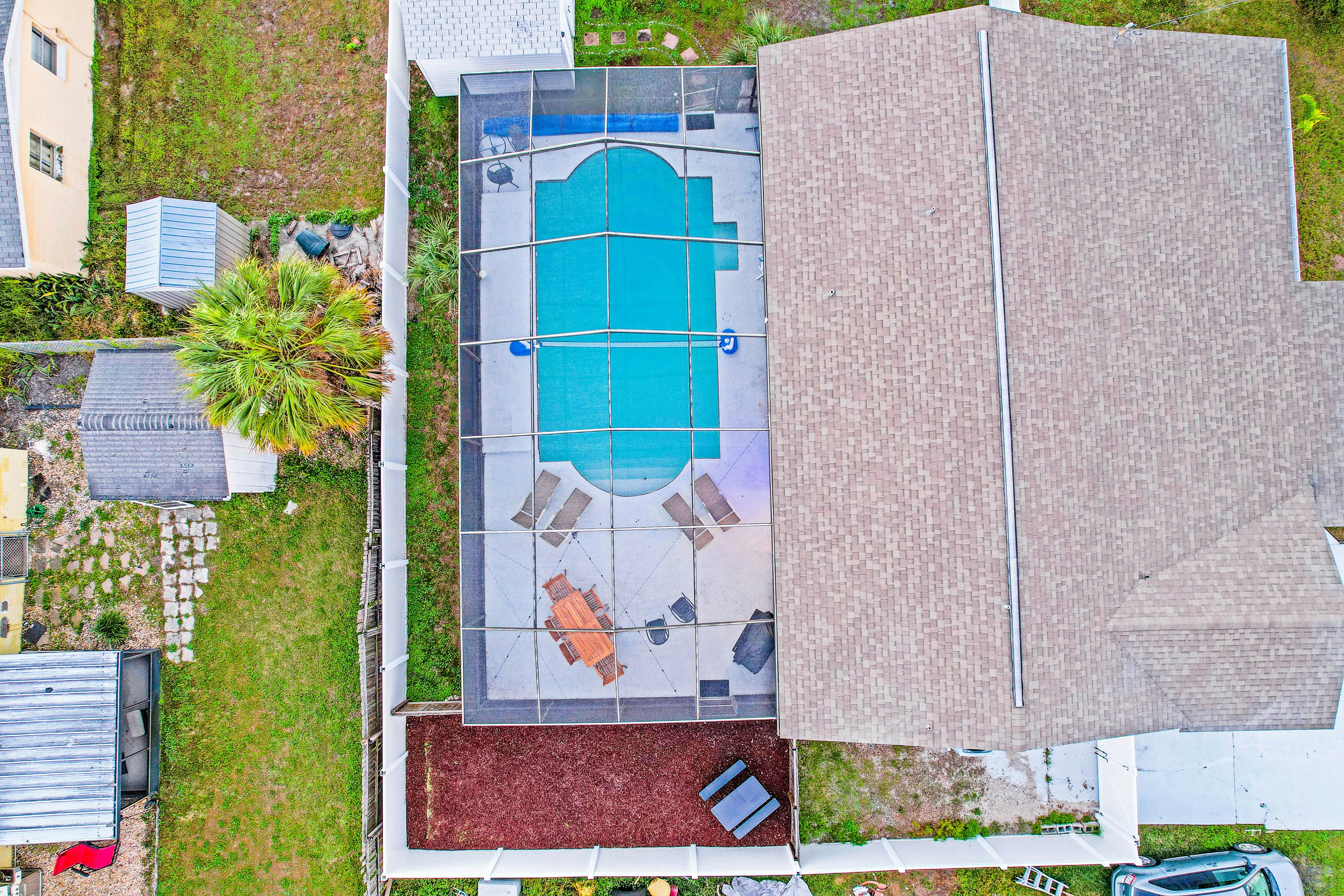 Dog-friendly tropical stay with a private pool, grill, game tables, & central AC