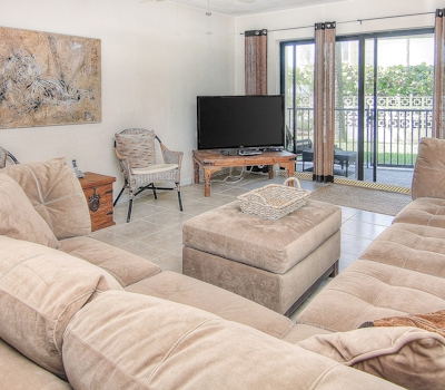 Elegant 1st floor condo w private patio AC on site outdoor pool and gas grills