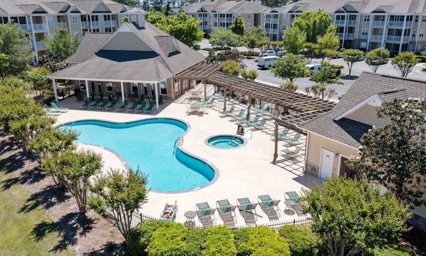 Golf community condo near beach with on-site pool, golf, & screened balcony