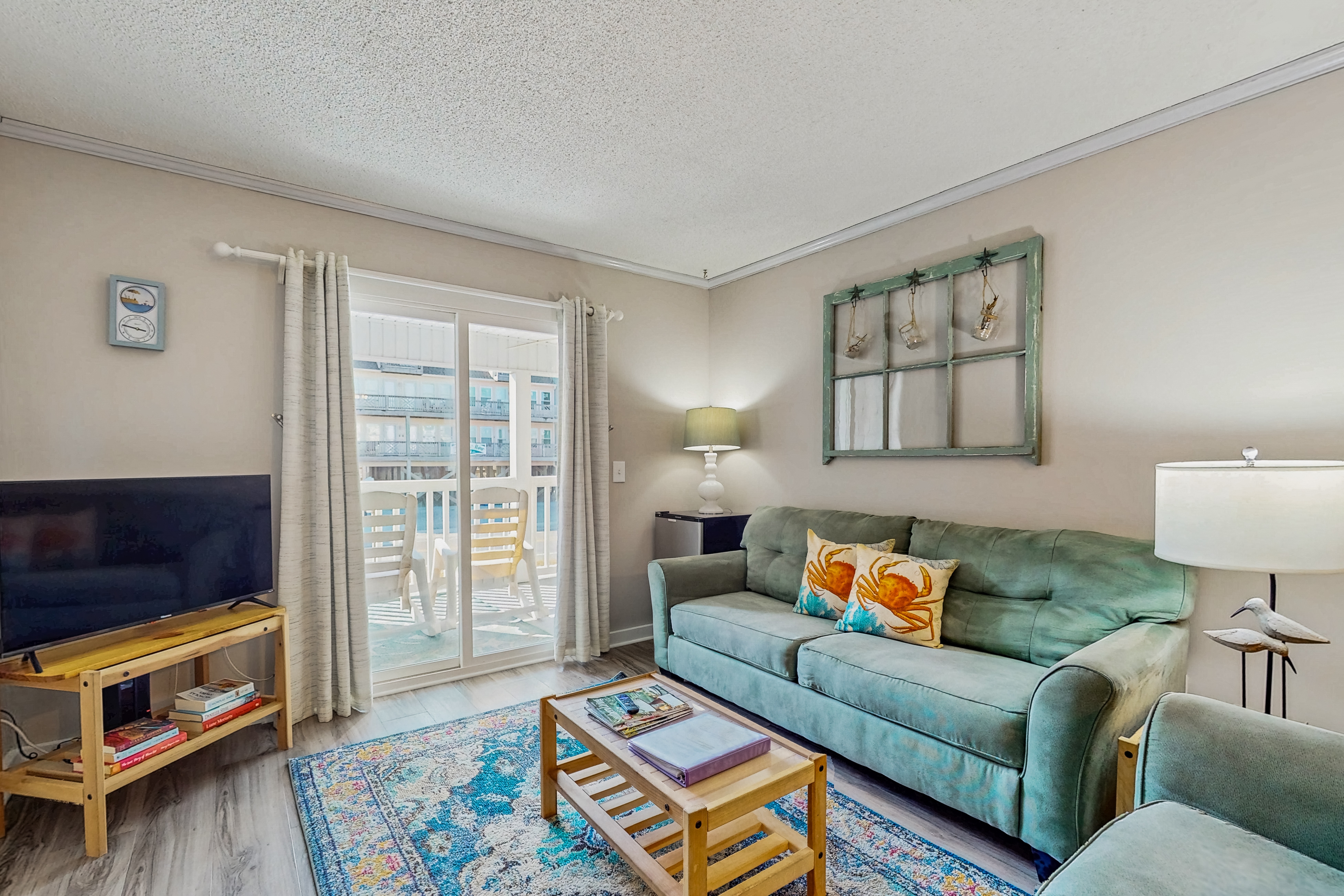 Updated condo with pool access, easy beach access & private balcony