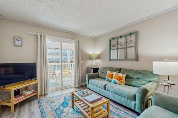 Updated condo with pool access, easy beach access & private balcony