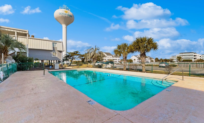 Updated condo with pool access, easy beach access & private balcony