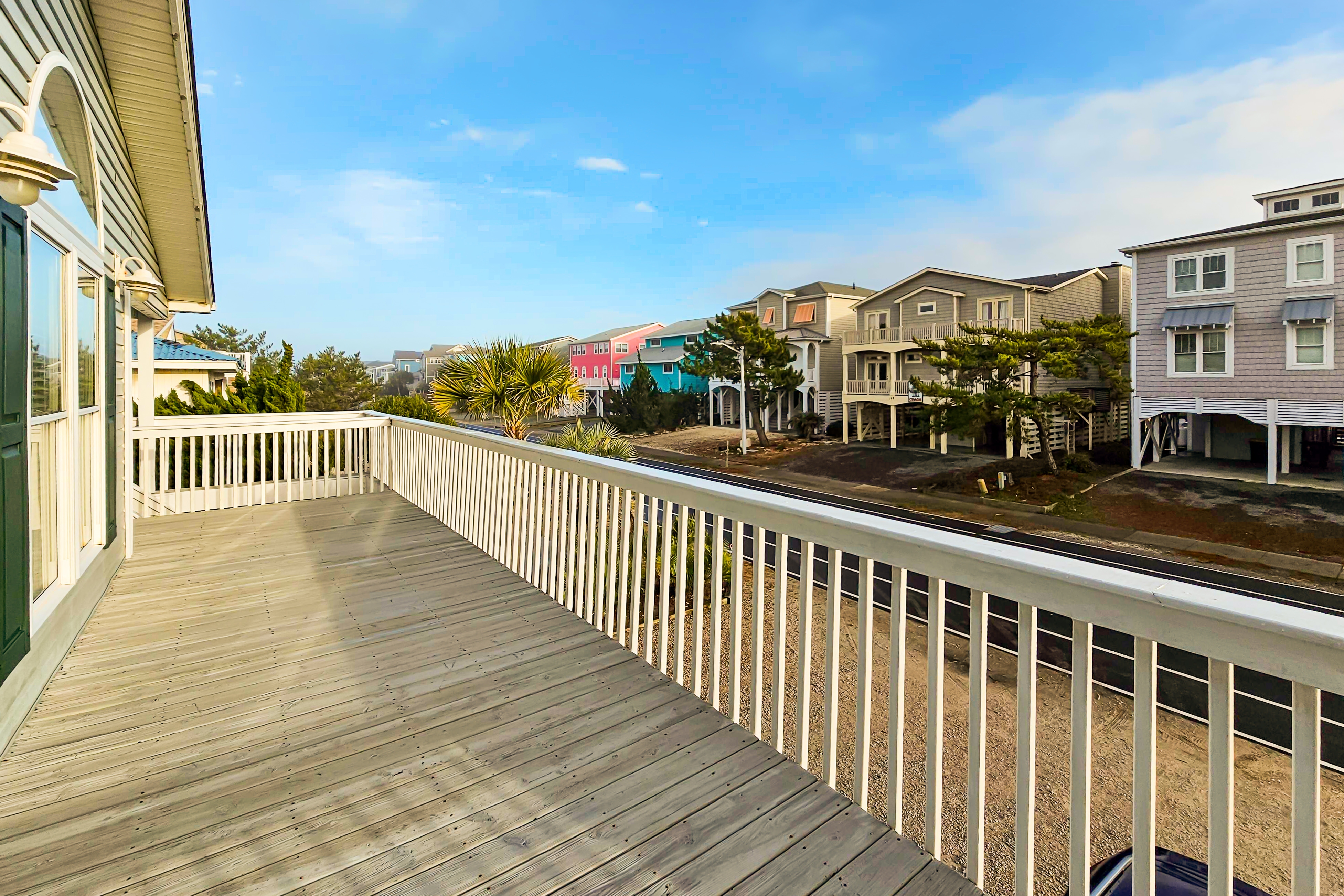 2nd-row modern home with beach access, trailer parking, deck, & outdoor shower