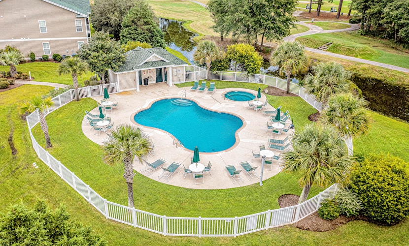 Affordable condo with pool, balcony, deck, full kitchen, washer/dryer, & TV