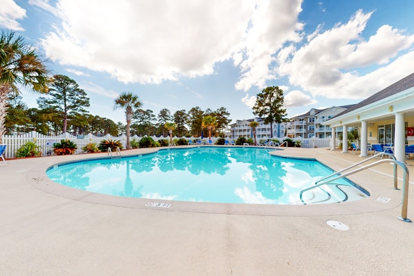 Coastal Condo with golf on-site, shared pool and fitness center