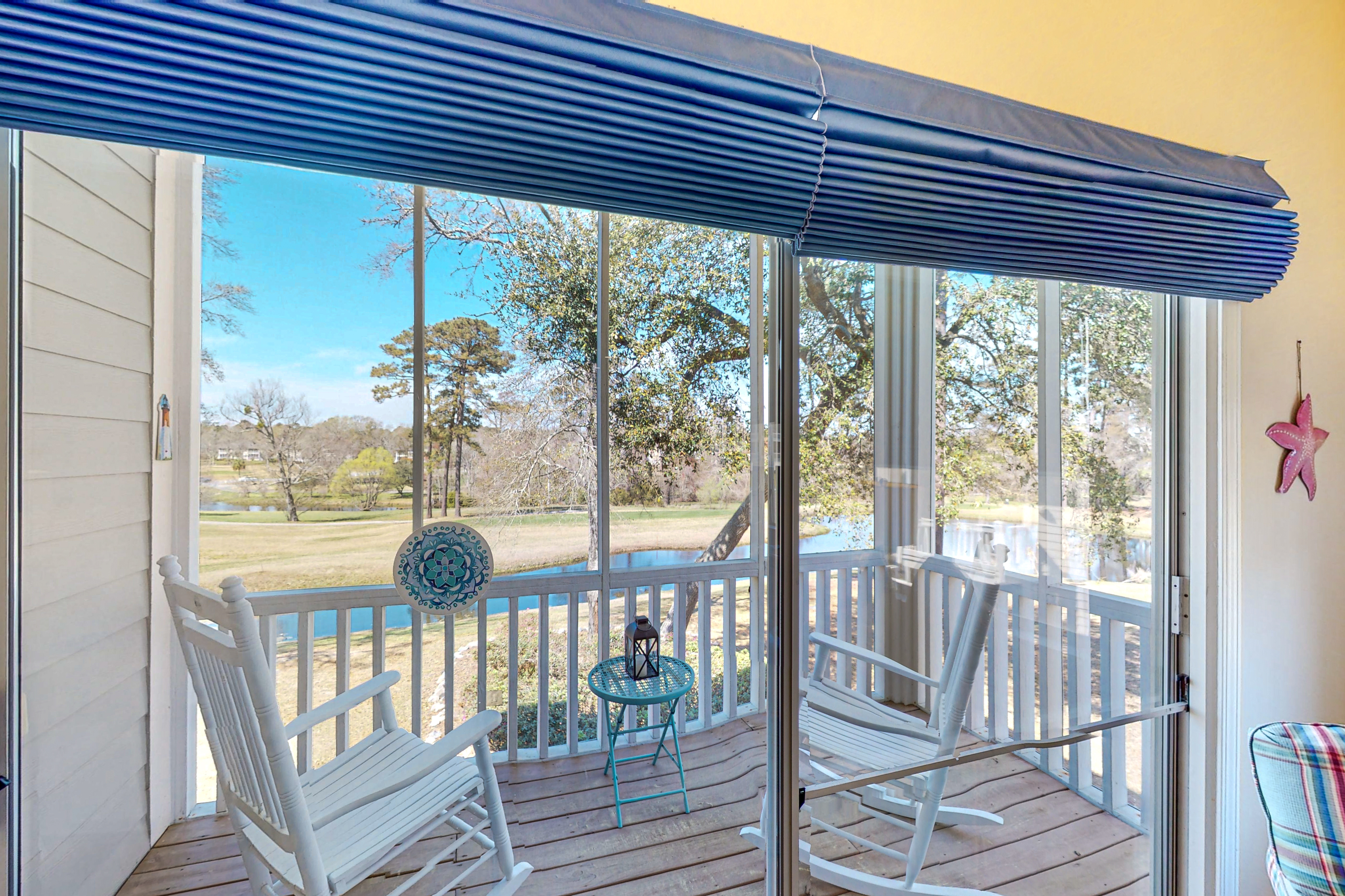 Clean condo with golf course & water views - with balcony, central AC, & W/D