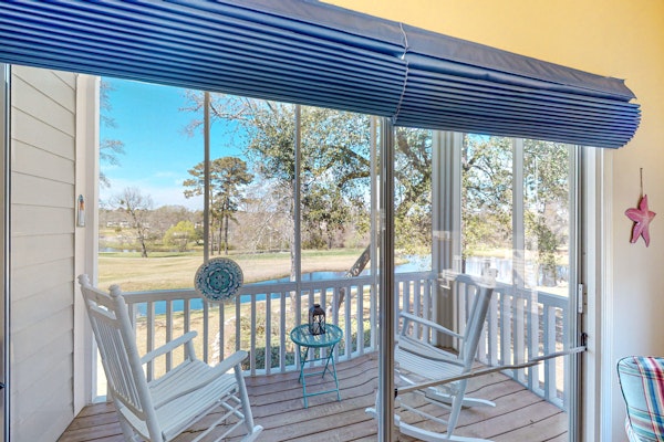 Clean condo with golf course & water views - with balcony, central AC, & W/D