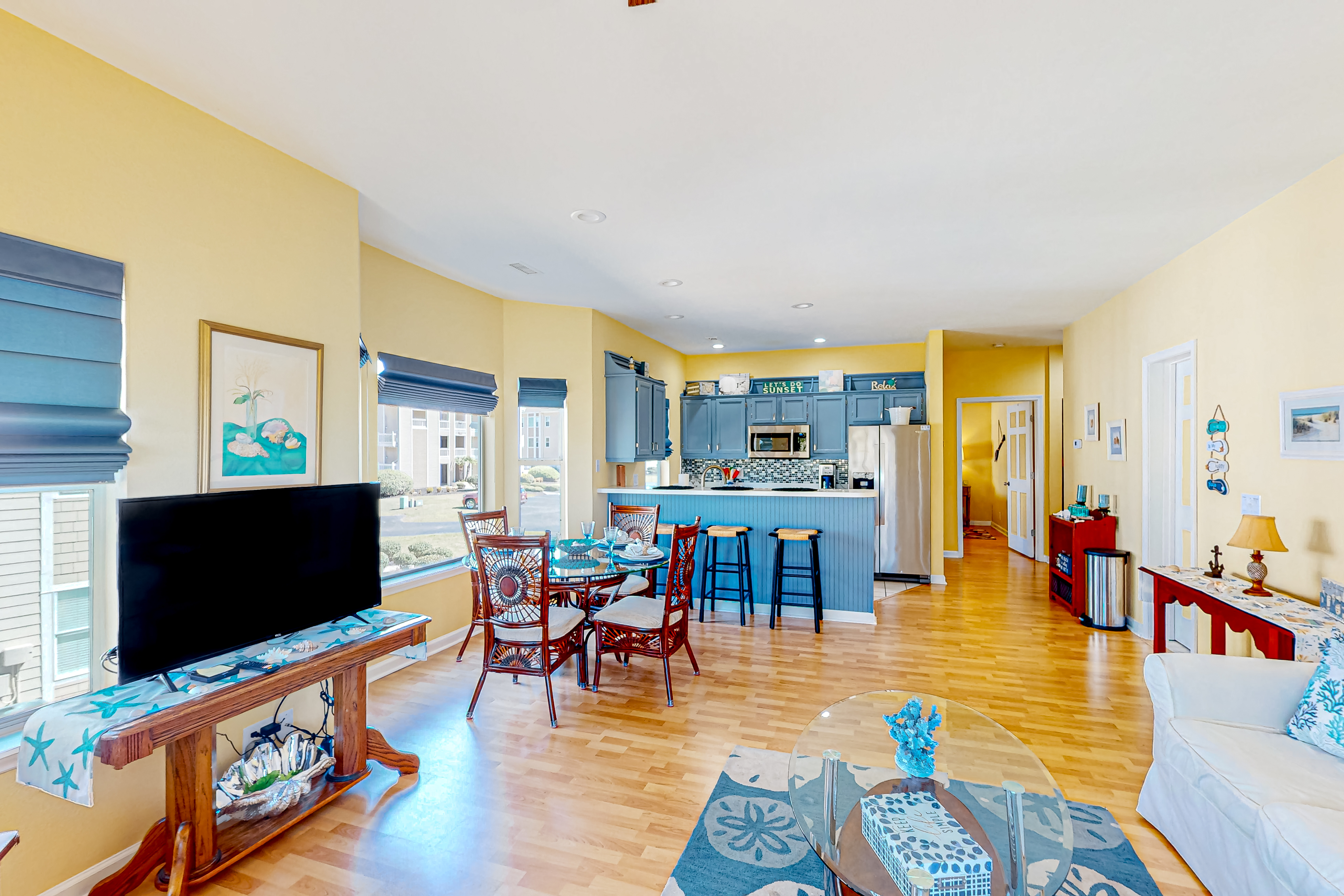 Clean condo with golf course & water views - with balcony, central AC, & W/D