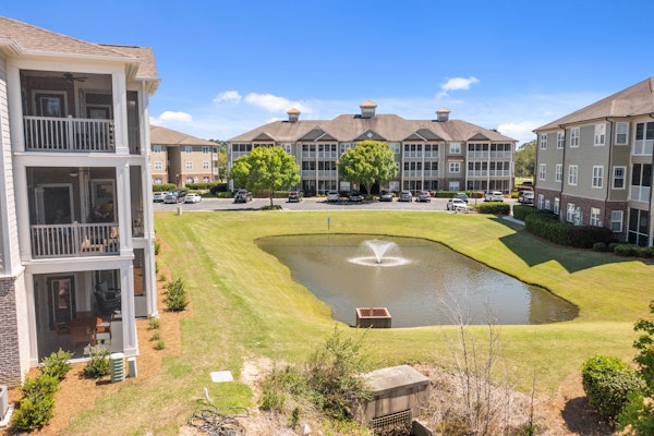 Centrally located condo with a patio, W/D, & AC - pool and on-site golf access
