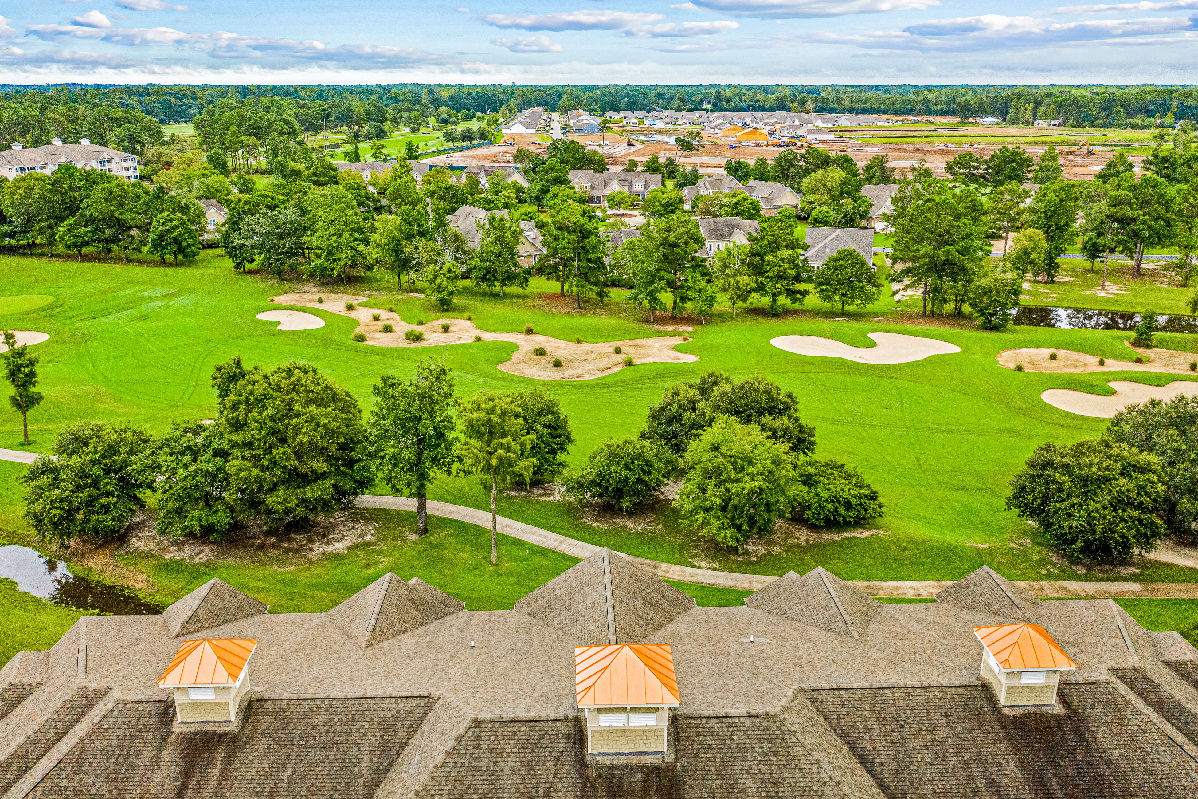 Golf-course-front villa at Crow Creek with screened porch and washer/dryer