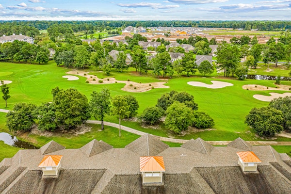 Golf-course-front villa at Crow Creek with screened porch and washer/dryer