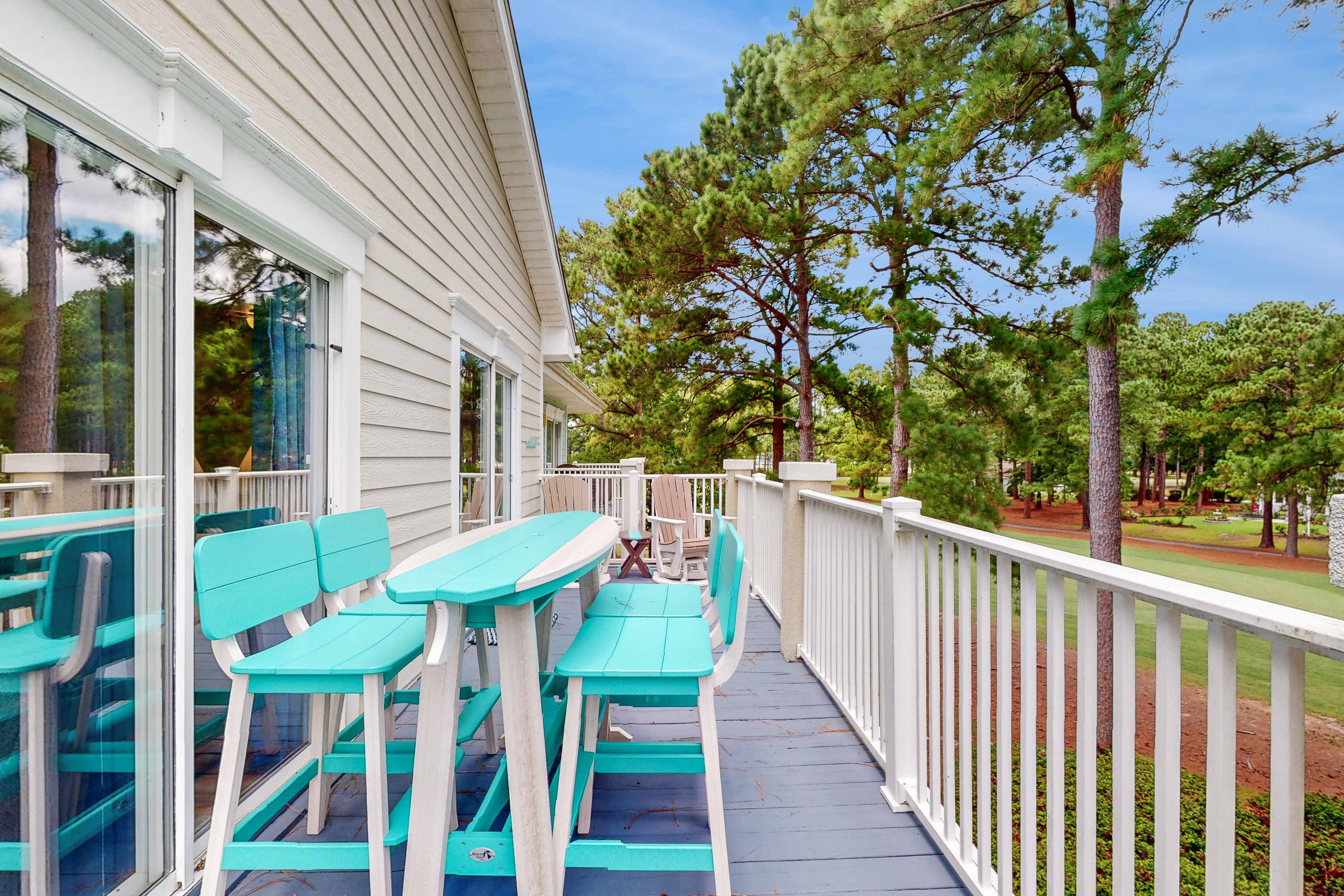 3rd-floor golf course-front condo with inviting deck, beaches & golf nearby