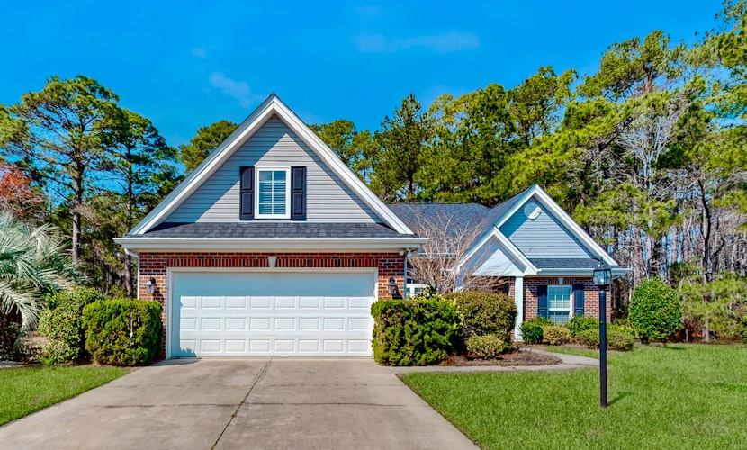 Dog-friendly coastal home with lovely patio, pool, & games - near beaches & golf