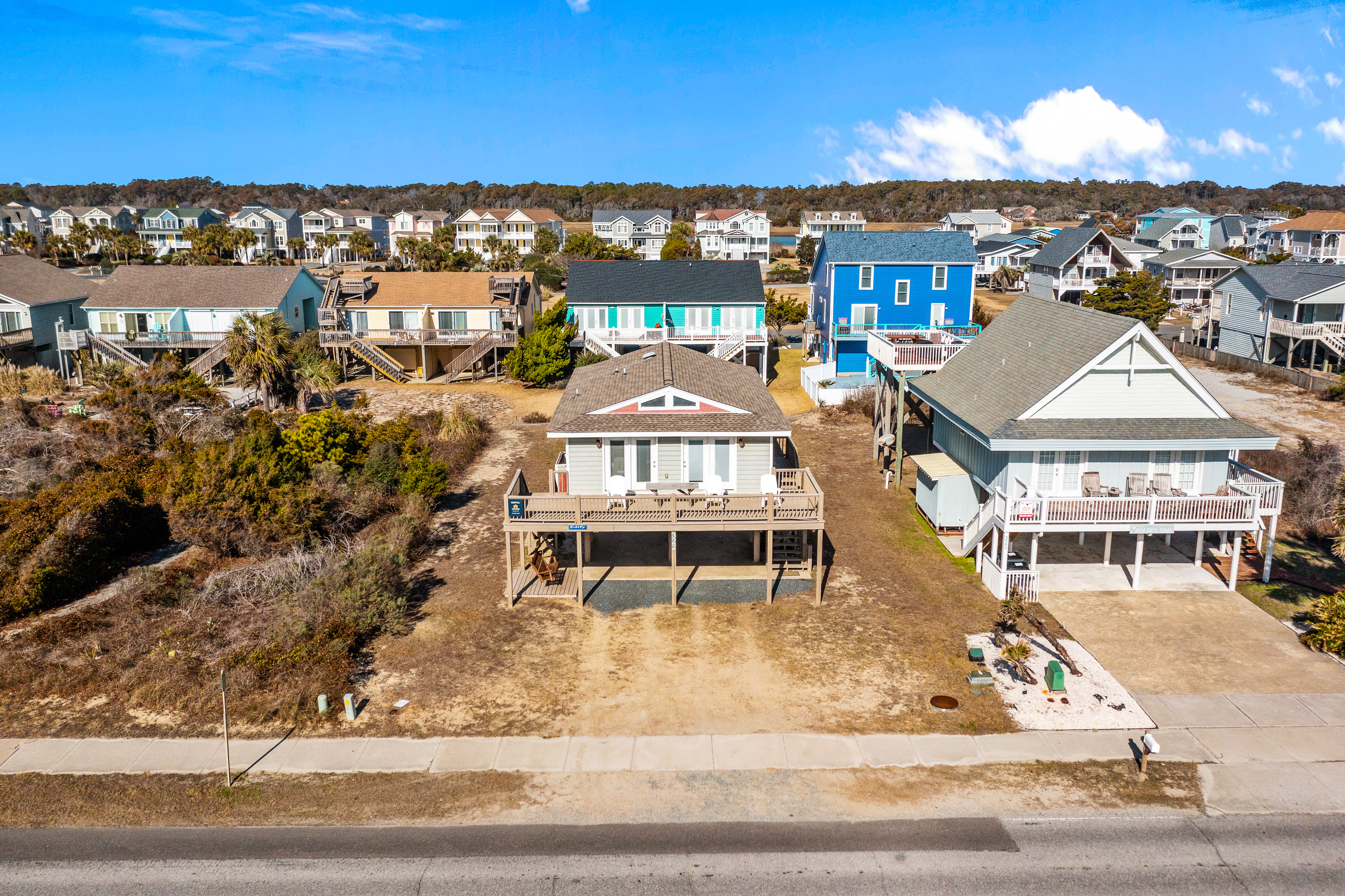 Large and roomy house across from the beach with WiFi, W/D, central AC, and deck