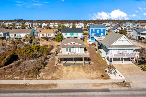 Large and roomy house across from the beach with WiFi, W/D, central AC, and deck