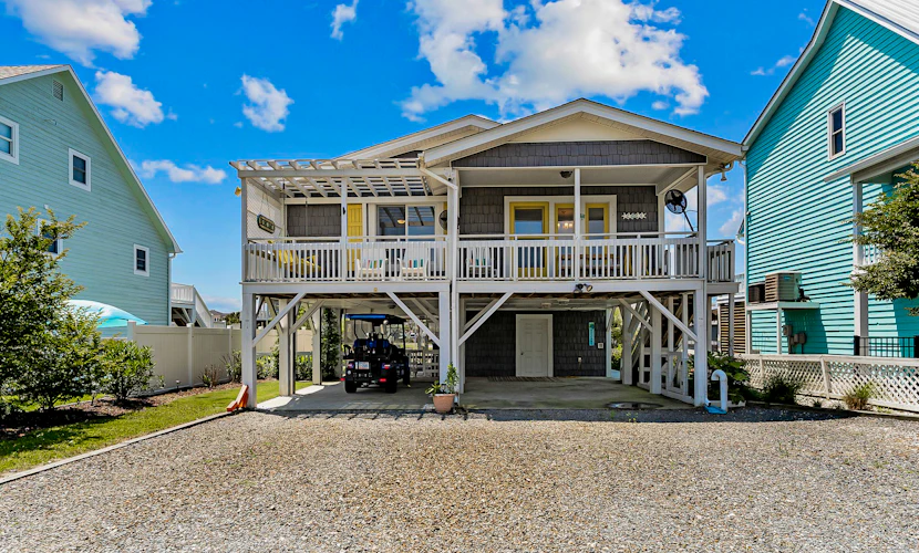 Waterfront home with Intracoastal views, outdoor areas, dock, & golf cart access